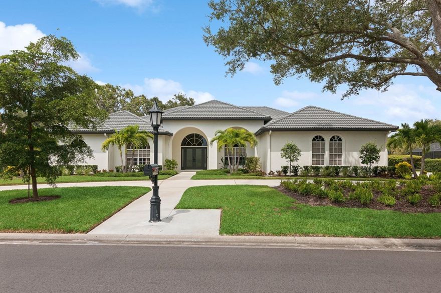 Situated on a tree-lined street within the upscaled gated community of Prestancia, in Palmer Ranch, this home backs onto a private lake along the 16th fairway of TPC Players Course, an International Audubon Golf Sanctuary, part of the esteemed global TPC Network of Clubs and Heritage Golf Group Collection of Clubs.

Custom designed and built, this home maximizes Florida’s natural beauty with ample windows. It blends indoor and outdoor spaces, allowing views, breezes, and sunlight to be part of the living experience. The Modern Universal Design interior layout, from 2021-2024, combines a laid-back coastal vibe with elegant boutique touches. The open-concept design is perfect for both relaxation and entertaining, featuring new walls, doors, flooring, electrical, lighting, and plumbing fixtures.

The owner’s wing offers a luxurious bedroom suite with a spa-like bath featuring a soaking tub, zero-entry shower, dual sinks, custom cabinetry with accent lighting, a dressing room, and ensuite laundry—a true sanctuary for comfort and accessibility.

The guest wing includes three spacious bedrooms, each with ensuite bathrooms and walk-in closets. Two offices feature large arched windows, built-in cabinets, and antique wood doors worthy of a décor magazine. The open kitchen integrates dining, living, and outdoor spaces, featuring an oversized island with seating for six, Maplewood cabinetry, gray quartzite countertops, and luxury appliances for a curated blend of Kentucky craftsmanship and European design. The pantry offers ample storage with deep drawers and shelves.

Luxury epoxy flooring enhances the foyer, while the living and dining rooms flow seamlessly to the outdoor space, where a redesigned pool, heated spa, and new protective cage overlook the serene golf course, ensuring privacy.

New exterior landscaping with native plants, fresh sod, and majestic live oaks provides low-maintenance ecological benefits. The three-car garage and parking for 10 vehicles make it perfect for hosting. Brand new roof, new HVAC system installed.

This property is centrally located near Siesta Beach, downtown Sarasota, Sarasota Airport, Sarasota Memorial Hospital, and local amenities like shopping, dining, and the Legacy Bike Trail.

Schedule your private showing today!