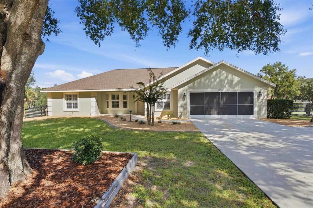 Photo of 40044 Agusta Drive, Lady Lake, FL 32159 (MLS # G5117298)