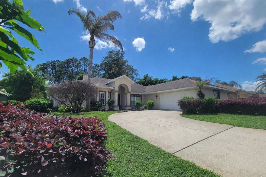 EXPERIENCE  TRUE FLORIDA LIVING IN THE  GOLF COMMUNITY OF DEBARY PLANTATION located in the heart of Volusia County. This beautifully upgraded 4-bedroom, 2-bathroom home offers PRIVACY with no rear neighbors and features an oversized side-entry garage with a beveled glass front door.
Step inside to expansive ceilings, custom architectural details, and a welcoming foyer that opens to a formal dining room with plantation shutters and cathedral ceilings. The updated kitchen highlights rennovation that  includes granite countertops, 42" cabinets, stainless steel appliances, recessed lighting, a breakfast bar, pantry, and a cozy eat-in nook with laundry room access.
The split bedroom layout provides comfort and convenience, with guest rooms located off a private hallway. The kitchen overlooks a spacious living room with laminate flooring, vaulted ceilings, and a ceiling fan. An enclosed BONUS  room  20X13 (under air ) with travertine flooring and vaulted ceilings offers flexible space for a home office, playroom, or entertainment area, with direct access to the open patio and backyard.
The primary MASTER suite features laminate flooring, a walk-in closet, and a remodeled en-suite bathroom  with granite countertops, a private commode, and a walk-in shower. The guest bathroom was also updated . Additional highlights include laminate flooring in all guest bedrooms,
 ROOF (2016), HVAC (2022) .FANTASTIC COMMUNITY AMMENITIES IN THIS SOUGHT OUT GOLF COMMUNITY . 
Don’t miss your chance to make this beautiful home yours.