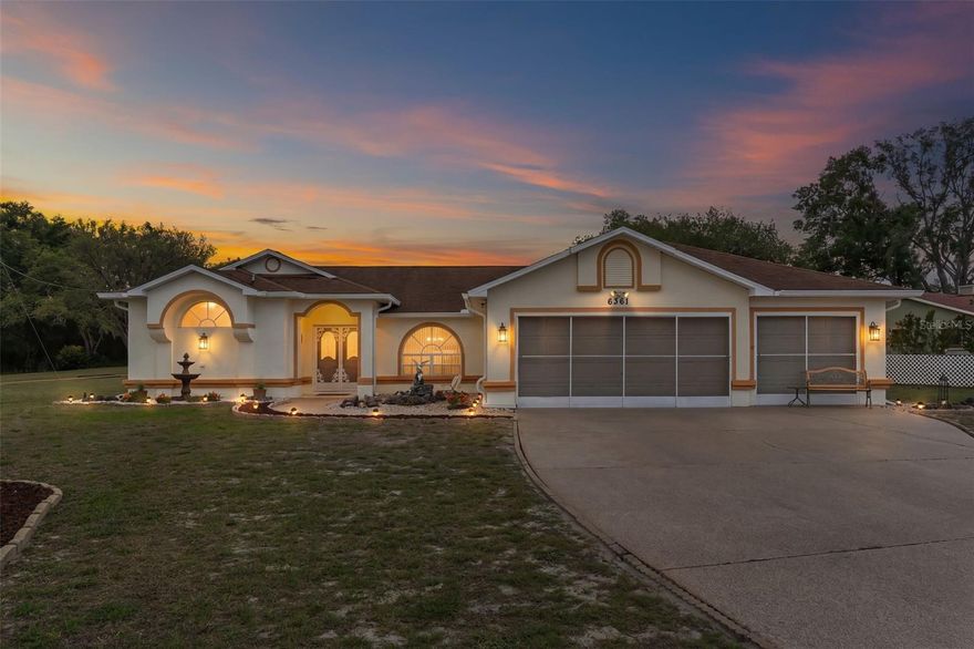 Welcome to this exceptionally well-maintained 3-bedroom, 2-bath home offering stunning lake views of Hunters Lake and an inviting open floor plan filled with natural light. A screened double-door entry leads into a spacious living room featuring cathedral ceilings, a ceiling fan, and pocket sliders that seamlessly connect to the enclosed Florida room--perfect for enjoying indoor-outdoor living year-round. The kitchen is beautifully updated with plant shelving, abundant cabinetry, skylights, and a breakfast bar, along with a separate breakfast nook overlooking the peaceful backyard and lake views. Ceramic tile runs throughout the home, complemented by chair rail detailing and ceiling fans in the main living areas. The split-bedroom layout includes a flexible third bedroom currently used as a den, easily convertible back to a full bedroom, while bedroom two offers dual closets for added storage. The spacious primary suite features private access to the Florida room, dual closets, plant shelving, and an en-suite bath with dual sinks, a walk-in tiled shower, linen closet, and transom window for added natural light. Additional highlights include a well-equipped laundry room with storage and utility sink, a pristine screened three-car garage with service door, motion-sensor exterior lighting, a textured driveway with decorative landscape edging, a detached 8x12 shed, and a manual irrigation system. Situated on a desirable corner lot at the entrance of a quiet cul-de-sac, this home combines comfort, functionality, and scenic surroundings in one impressive package. Homes with this level of care, layout, and lake view don't last--schedule your private showing today and experience it for yourself before it's gone.