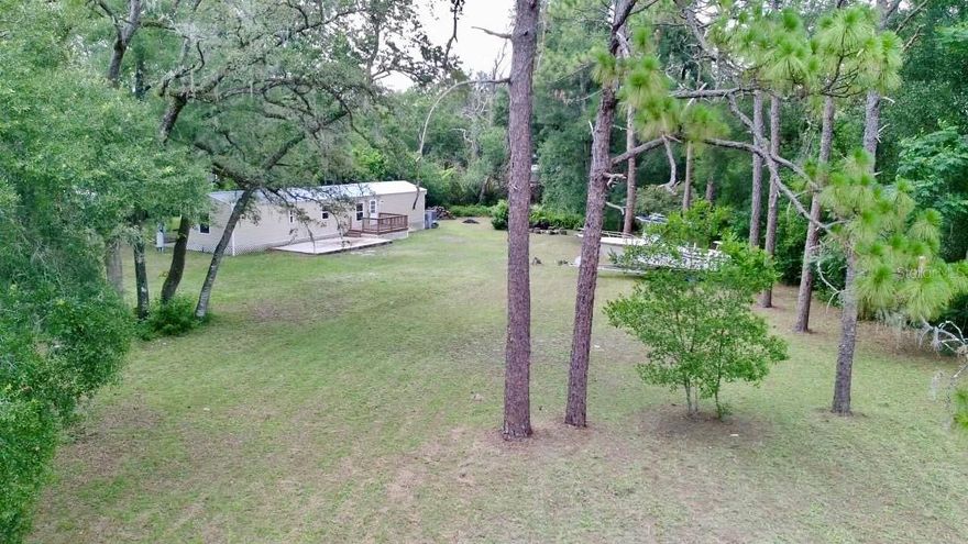 AFFORDABLE ACREAGE WITH ENDLESS POSSIBILITIES!!! THIS 3 BEDROOM 2 BATH HOME IS COMPLETELY UPDATED THROUGHOUT WITH NEW FLOORING, SPECTACULAR KITCHEN AND BATHROOMS AND THE LAND IT MOSTLY CLEARED WHICH ALLOWS FOR LARGE STORAGE AREAS OR IF YOU PREFER TO HAVE LIVESTOCK IT IS FULLY FENCED IN SO BRING YOUR CHICKENS, GOATS, HORSES, OR WHATEVER YOU HEART DESIRES. THIS HOME IS SITUATED ON A VERY QUIET COUNTRY ROAD AND IS JUST MINUTES TO SHOPPING AND OTHER LOCAL ESTABLISHMENTS. THERE IS A LARGE GATE AT THE ENTRY WHICH ALLOWS FOR LARGE VEHICLES OR BOATS TO EASILY GET INTO THE DRIVEWAY AND HOME.
