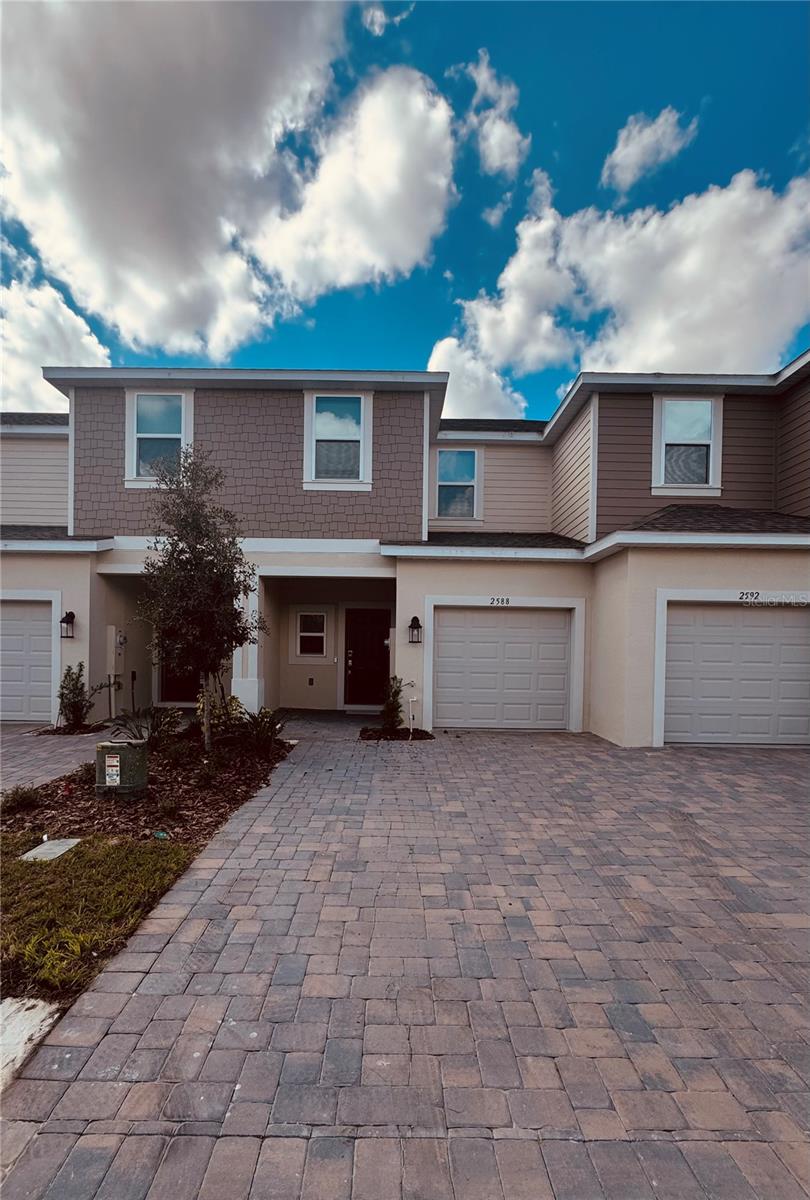 Discover modern comfort in this brand-new, two-story townhome nestled in a serene Polk County community. Boasting tile flooring throughout for easy living, this pristine residence backs directly to a peaceful conservation area, offering beautiful views and abundant natural light. Enjoy the perfect blend of contemporary upgrades and a tranquil, private setting, ideal for long-term living.