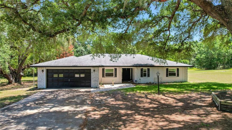 Escape to peaceful country living in this beautifully updated 4-bedroom, 2-bathroom POOL home situated on 3 private acres in Weirsdale. Inside, you’ll find gorgeous engineered hardwood floors, sleek tile flooring, a desirable split floor plan, and stunning views overlooking the pool area. The updated kitchen features stainless steel appliances, granite countertops, stylish white cabinetry, custom molding, and a modern tile backsplash. The oversized primary suite offers tons of space, a large walk-in closet, and an updated en suite bathroom complete with a spacious walk-in shower. An added bonus is the 4th bedroom/craft room/den which is oversized but does not have a closet. Additional highlights include an interior laundry room and an oversized garage. Step outside to enjoy your expansive pool deck, large pool (20'x40') and fully fenced pool area, perfect for entertaining or relaxing in your own private retreat. Major upgrades provide peace of mind, including all new low-emissivity double-pane windows and sliding glass door in 2015 with a transferable lifetime warranty, new roof in 2020, pool resurfacing in 2016, new water heater in 2024, and a brand new HVAC system in 2025. Conveniently located just 10 minutes from shopping, dining, and The Villages, this property offers the perfect blend of privacy, comfort, and convenience.