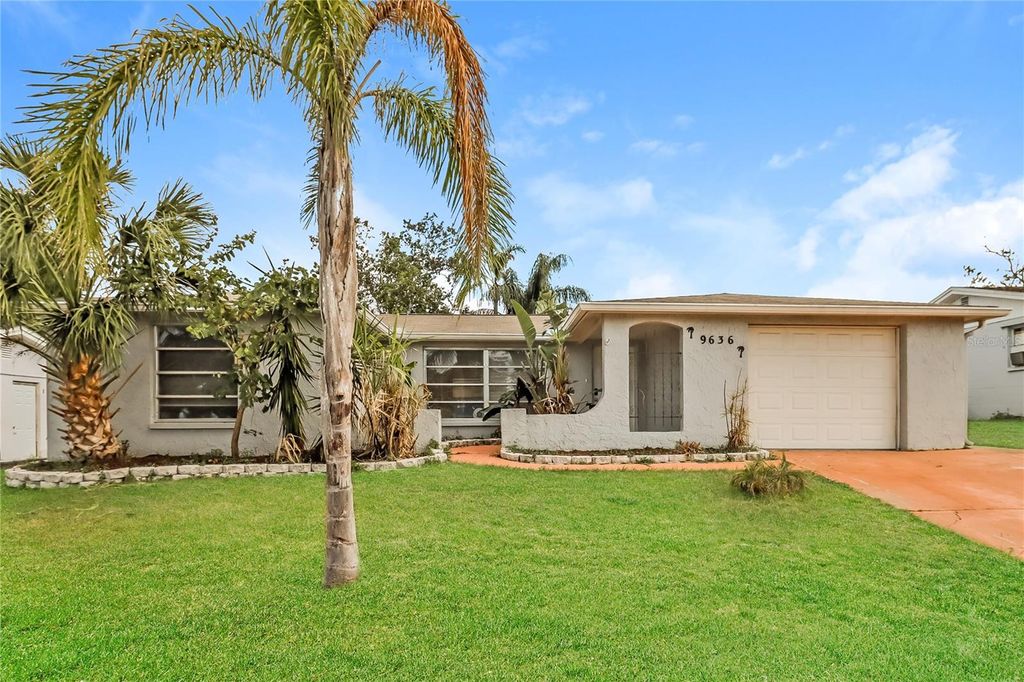 Photo of 9636 Mark Twain Lane, Port Richey, FL 34668 (MLS # O6373455)