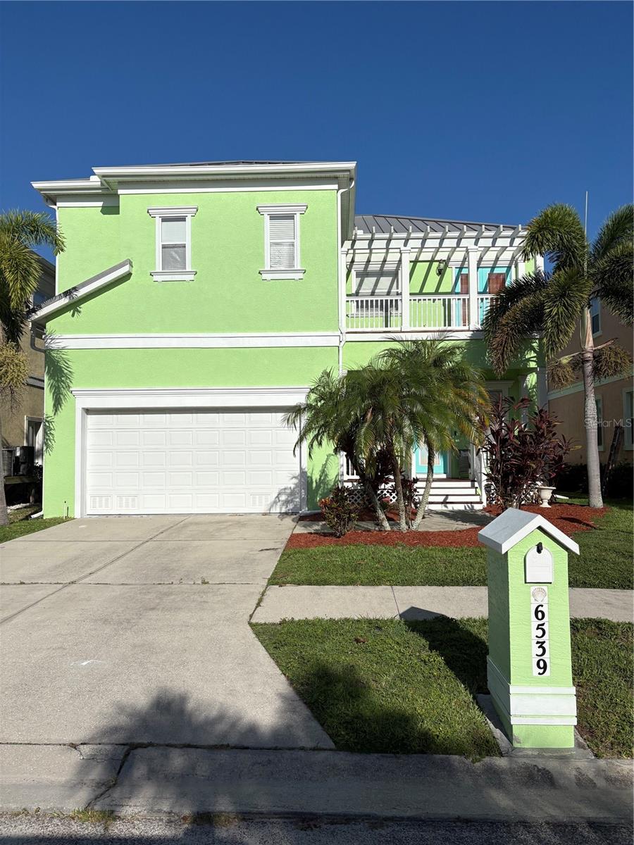 Live the Key West lifestyle in Apollo Beach! Wow, this beautiful custom home is ready for you; room for everyone, yet still as cute as a button! This 4 bedroom 3 1/2 bath home has adorable wooden porches on both the front and back of this home, upstairs and down!! Custom tray ceilings and crown moldings add an elegant touch to this incredible home. Large kitchen with tons of cabinet space and even a wet bar!! Beautiful wood spindles wrap around you as you head upstairs to the 4 LARGE bedrooms and second floor utility: no dragging those clothes up and down the stairs!! The home has 2 ensuite bedrooms including the primary with garden tub; both with their very own private balcony. Private fenced back yard is perfect for back yard gatherings. And if that wasn't enough.... Seller is offering $10,000 toward new flooring or closing cost assistance!! Close to local beaches and marinas, yet just minutes from 1-75 and US 41 and tons of restaurants and shopping......Location Location Location! There is NO CDD and since the HOA dues include Lawn Care....You will have plenty of time to enjoy that Key West Lifestyle!! Don't let this one get away!