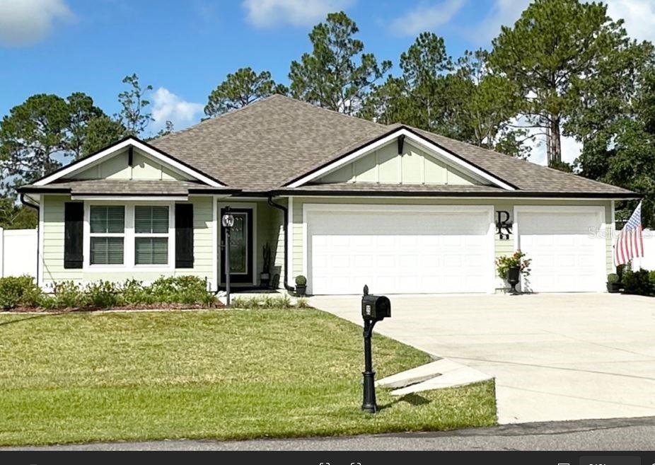 Buy this home and you could have instant equity! This beautifully upgraded 4-bedroom, 3-bath home on a .30 acre lot features over $40,000 in enhancements, including an extended screened lanai, vinyl fenced backyard, 4-zone irrigation system with private well, upgraded lighting, and ceiling fans throughout. Flexible floor plan includes a dedicated flex room with French doors—perfect for a home office, gym, or playroom. The open-concept kitchen offers granite countertops, a large island, maple cabinetry, stainless steel appliances, a walk-in pantry, and two dining areas. The primary suite features dual walk-in closets and a spa-style en-suite with a walk-in shower. Two guest bedrooms each have adjacent bathrooms, ideal for visitors or multigenerational living. Triple glass-panel sliders fill the living area with natural light and open to the oversized lanai with ceiling fans. Additional features include: 3-car garage with custom built-in shelving, Large backyard, Large dual detached storage shed/workshop and Smart Home-ready features Located on a low traffic street in a quiet neighborhood just minutes from shopping, dining, and 15 minutes to Flagler Beach. Schedule your showing today—this home is priced to sell fast! Make it your home before someone else makes it theirs!