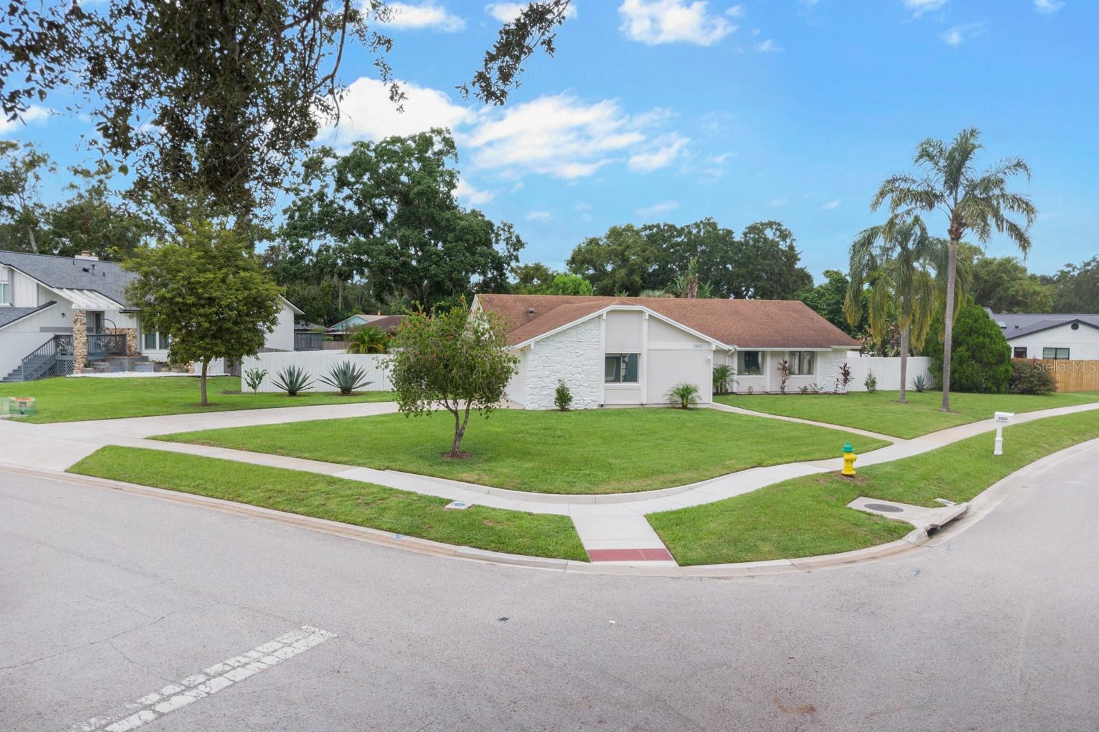 Welcome to this beautifully updated pool home in the highly desirable Howell Cove community, Casselberry’s best-kept secret. Situated on a generous 1/3-acre corner lot, this home blends modern upgrades with inviting spaces perfect for both entertaining and everyday living. Elegant double entry doors open to a bright, open floor plan where the kitchen, dining, and living areas connect seamlessly. The remodeled kitchen, completed in 2017, offers new stainless steel appliances including a gas range, range hood, refrigerator, dishwasher, and disposal, as well as abundant cabinetry and counter space, making it ideal for both cooking and entertaining.
Throughout the home, luxury vinyl flooring adds a fresh, modern feel, while the cozy fireplace in the family room creates the perfect spot to gather. Both the master and guest bathrooms have been thoughtfully remodeled with floating vanities and sleek finishes, and the master bathroom features a glass-semi enclosed tub that can also be used as a shower. The garage has been freshly painted and finished with an epoxy floor, while the spacious finished attic above provides an abundance of extra storage, ensuring there is still plenty of room to park cars inside.
Step outside to the screened porch overlooking the sparkling, extra-deep pool, which has been recently resurfaced and upgraded with a multi-speed pump and filter system. The expansive fenced backyard, surrounded by new landscaping featuring palm trees, cactus, and agave, creates a special tropical-meets-desert vibe that feels both private and unique.
This home has been exceptionally well maintained with fresh interior and exterior paint, upgraded door hardware, a complete replacement of all plumbing to eliminate copper pipes, and new A/C refrigerant lines in 2023. Every detail reflects the care and pride of ownership the sellers have invested during their 15 years here.
Howell Cove offers a true sense of community, where neighbors come together for events and take pride in their homes, all while enjoying the freedom of a non-HOA. The sellers have loved the cul-de-sac location, the welcoming atmosphere, and the beautifully kept neighborhood. Just minutes away, Red Bug Lake Park offers sports fields, fishing docks, trails, playgrounds, and more, while Oviedo Mall, Oviedo on the Park, and Altamonte Mall are only 15 minutes away, and Winter Park’s shops and dining can be reached in just 20 minutes. With top-rated schools, shopping, dining, and major roadways all nearby, this home combines the best of convenience, comfort, and community.