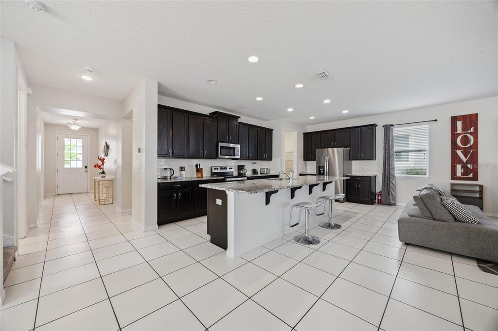 Photo of 9008 Sunshine Ridge Loop, Kissimmee, FL 34747 (MLS # O6396158)