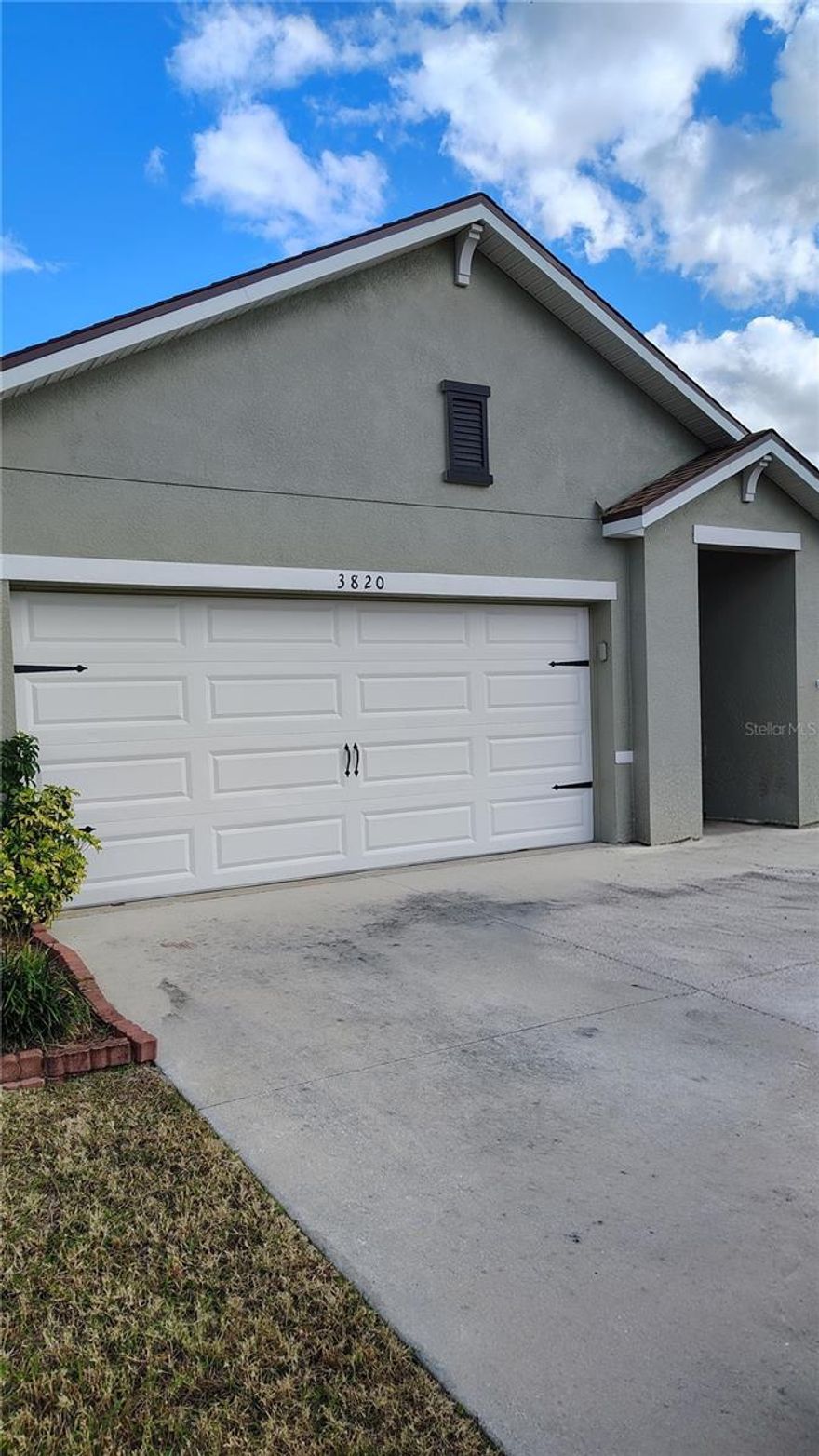 Welcome to the beautiful community of Magnolia Green in Plant City! This modern home features a desirable split floor plan designed for comfort and privacy. Offering 3 bedrooms , 2 bathrooms and a 2-car garage, this home is perfect for families, seasonal residents, or anyone seeking a functional and stylish layout. The private primary suite is tucked away from the secondary bedrooms, creating a peaceful retreat complete with an ensuite bath and walk in closet. The heart of the home showcases an open concept design, seamlessly connecting the living, dining, and kitchen areas-perfect for entertaining or everyday living. The kitchen offers modern finishes, ample cabinetry and a convenient large closet pantry. Step outside to enjoy the oversized backyard, fully enclosed with a vinyl privacy fence, providing both security and plenty of space for pets, play or future outdoor enhancements. Situated on a premium corner lot, the property offers added curb appeal and extra yard space. With newer roof and A/C system, plus recent paint inside and out, its ideal layout, great outdoor space, and convenient 2-car garage, this home is move-in ready and a must see!