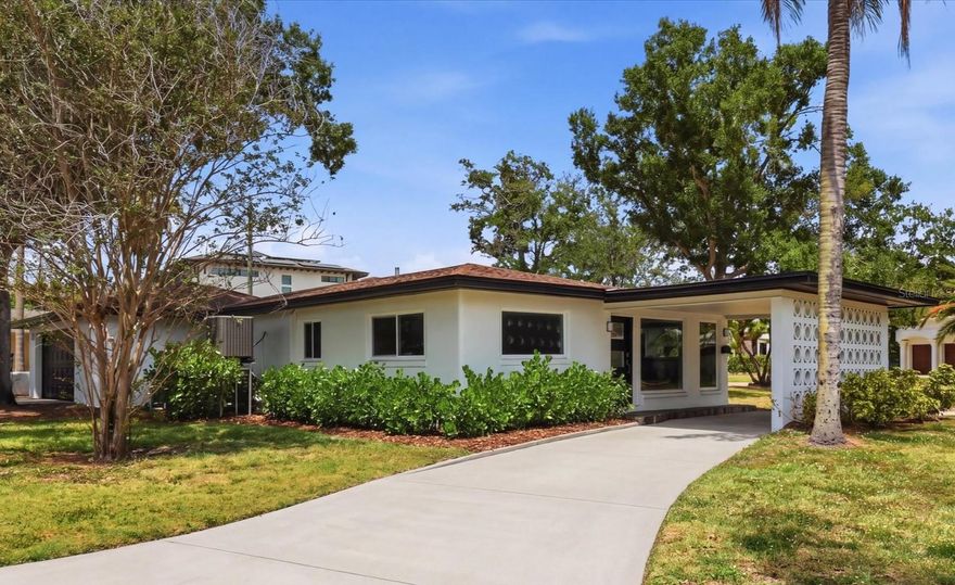 Live the Davis Islands life with this fully renovated single-story home on an expansive 10,900 sq ft corner lot. Offering 4 bedrooms, 3 baths, a dedicated office/den, 2-car garage, and over 2,400 sq ft of thoughtfully designed living space — this is the move-in ready home you have been searching for.

The open floor plan flows effortlessly, making the most of every square foot. Large picture windows anchor the family room at the front of the home, bathing the space in natural light. This room connects with the more formal dining area as well as a private office/den off the main living area, perfect for working from home or a playroom. An additional separate living room overlooks the large screened-in porch and backyard, creating a great space for entertaining or relaxing.

The kitchen has been completely redesigned with quartz countertops, plenty of wood cabinetry in a two-tone palette of blue lowers and white uppers, new stainless steel appliances, and a peninsula for casual dining. A dedicated coffee bar with wine fridge and additional storage adds a great finishing touch.

The split-bedroom layout places two bedrooms on each side of the home, offering added privacy. The primary suite features built-in closets while the primary bath boasts a dual vessel vanity, glass-enclosed walk-in shower, and modern tile finish. The two additional bathrooms have been enhanced with updated vanities — one featuring a walk-in shower and the other a tub/shower combination. All bedrooms are generously sized, offering comfortable space for family or guests.

Additional updates include new LVP flooring throughout, new central A/C (2025) plus new mini-split (2025), new water heater (2025), updated electrical, hurricane impact windows, and artificial turf in the rear yard.

Located on picturesque Davis Islands, this home offers an unparalleled lifestyle in a vibrant, walkable community favored by professional athletes, executives, and families alike. The neighborhood is home to a wealth of amenities, including Marjory Park Marina, the Sandra Freedman Tennis Complex, the historic Roy Jenkins pool, and Peter O. Knight Airport. A short stroll brings you to the Davis Islands Village, where you'll find a variety of restaurants and shops. With its prime location just minutes from Downtown Tampa, Water Street, Sparkman Wharf, and the Tampa Riverwalk, this home truly offers the best of both island living and urban convenience. Additionally, it is situated within the boundaries of the highly rated Gorrie Elementary, Wilson Middle School, and Plant High School.