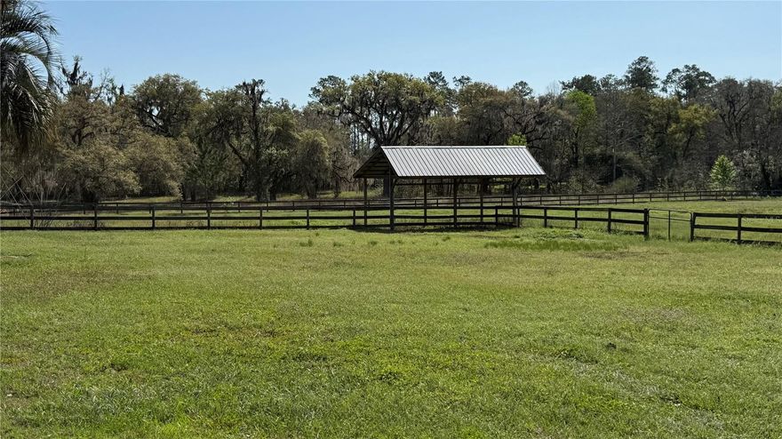 "Diamond in the Rough" best describes this property. Almost 6 acres of Gorgeous Land. Located just 6 miles from the World Equestrian Center and 3 miles to HITS. Tucked back in a quiet equine community. No HOA. There is an old Mobile Home on the property that has not been updated and is currently rented without a lease. The Value is in the Location and Acreage itself . The great thing about this property is the fact there is already a Well ( recently serviced with a new pump) and there is a septic tank in place. The Beautiful Old Oaks and Great Pasture are a must see. It is fenced / cross fenced in Board fencing with two paddocks currently in place. There is a very useable Pole barn with Electric . There is another barn that is in disrepair and needs to be removed but has electric run to it.  
Although some of the property is located in the 100 year flood zone, the Homesite is NOT IN THE FLOOD ZONE. The seller says the far pasture may have water pooling for a few days after a heavy storm but it doesn't stay wet.  Additionaly, there is an adjoining 1+ acre property with a nice Home on it currently for sale if one wanted to entertain buying both see MLS# OM717012.
