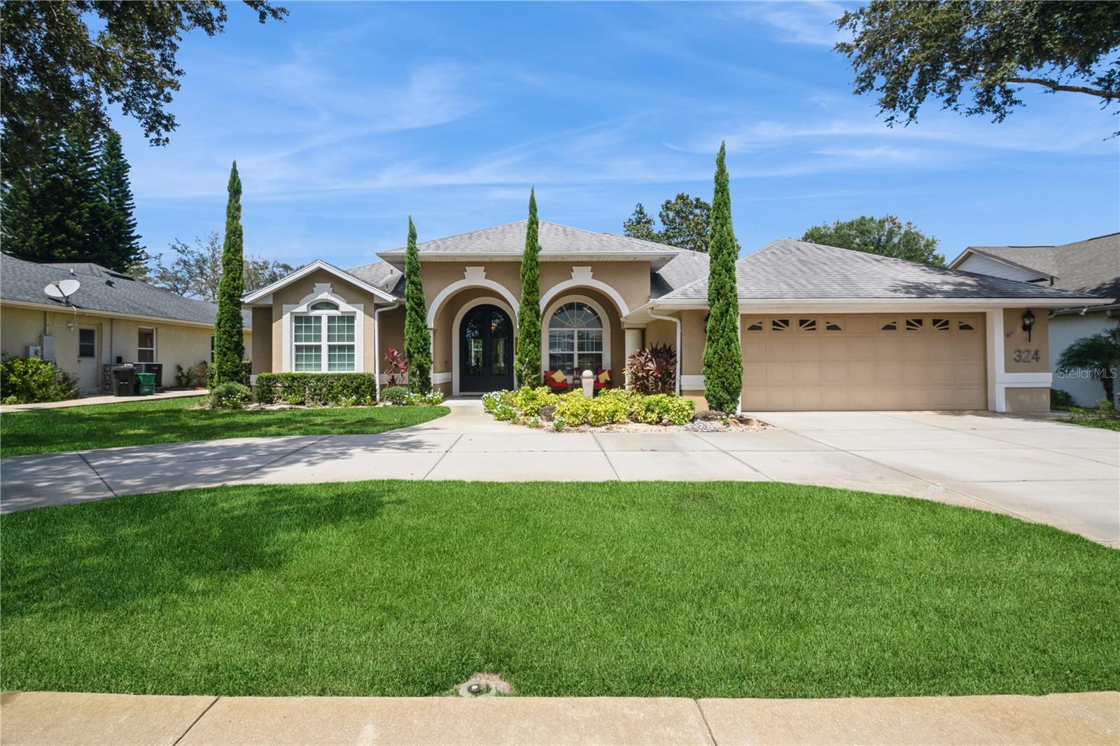 Great curb appeal on this beautifully maintained home located on #10 fairway in the golfing community of Debary Golf & Country Club. Enter through the oversized custom front doors into the formal living and dining rooms with hardwood flooring and upgraded light fixtures. The heart of the home is the totally remodeled kitchen with 42"cabinets, quartz counters, island w/hanging pot rack, under cabinet lighting and newer stainless appliances including double ovens. This open and bright floorplan includes 4 bedrooms, a three way split plan offering privacy for family or guests, 3 full baths, dinette, family room with built ins, interior laundry room with additional cabinets & laundry sink, 2 car oversized garage with storage, screened lanai with tile flooring, a spacious storage room off the patio and an outside extended paver patio. The upgrades include: Hot Springs Spa, plantation shutters, remodeled primary bath, well irrigation, hardwood flooring, new water heater, crown molding, epoxy garage floor, circular driveway and mature landscaping. Conveniently located to I-4, the Debary Sunrail Station, good schools, medical facilities, shopping and restaurants. 40 minutes to the East coast beaches or the Orlando airport and 15 minutes to the Lake Mary/Heathrow corporate corridor. Debary Golf & Country Club has memberships available for golf, tennis, pickleball, fitness center, pool and dining. This home may be under audio and visual surveillance.