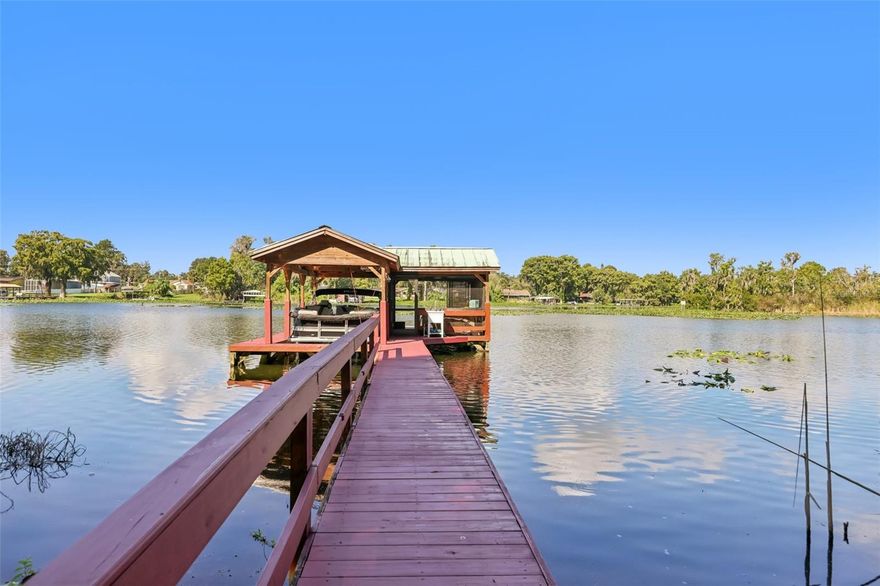 Welcome to Palmora Park ON THE WATER!!! One of Leesburg’s most beloved neighborhoods for generations with NO HOA. With its tree-lined streets, historic character, and reputation as a safe, welcoming community, Palmora Park remains one of the city’s most desirable communities. Residents love the golf cart–friendly lifestyle, neighborhood parks, and close proximity to Downtown Leesburg’s shops, dining, and year-round festivals.

This waterfront gem offers over 3,200 square feet with 3 bedrooms, 2.5 bathrooms, and a versatile split-bedroom layout. The primary suite on the main floor includes a wheelchair-accessible bathroom and a secret walk-in closet hidden behind a mirror. Upstairs, you’ll find a huge secondary master suite—ideal for guests or multigenerational living.

Inside, enjoy multiple living areas, a bright eat-in kitchen with ample storage, and an expansive screened back patio overlooking the water. Outside, the lush backyard leads to your private screened-in dock with a boat lift, the ultimate spot for launching boating adventures or relaxing with unforgettable sunsets over the lagoon that connects to the Lake Harris Chain of Lakes.

Blending Palmora Park’s timeless prestige with modern comfort and rare waterfront amenities, this one-of-a-kind property delivers space, character, and the lifestyle you’ve been dreaming of.

This charming 1949 Home has been completely professionally renovated inside and out by Mastrosimone Construction in 2021/2022.
New Main AC system replaced Jun 2025 including ventilation cleaning and a UV Microbial system for clean air.
The house is also protected by a million dollar termite bond on McCall Pest.
Roof is 10 years old