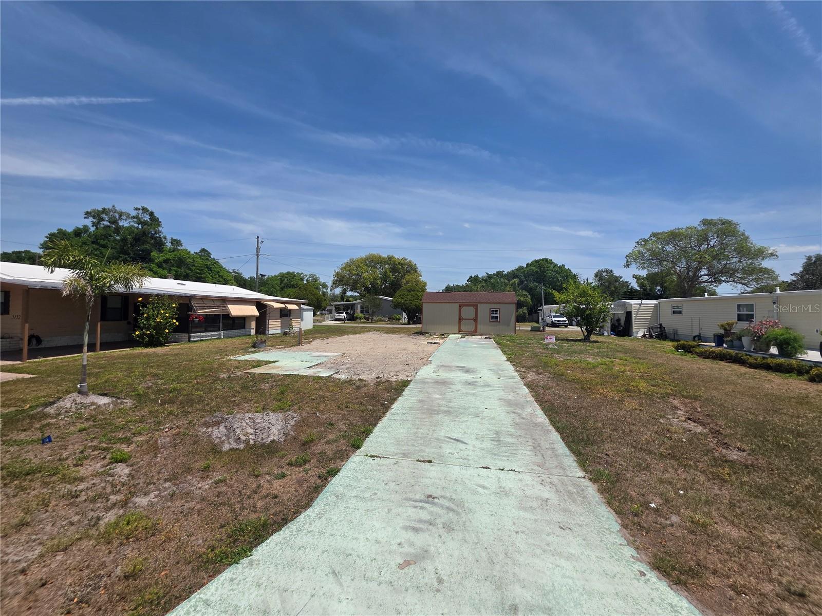 Are you ready to build your dream home in an exceptional Land owned 55+ golf community? Look no further! This 60' x 93' oversized lot offers you the opportunity you've been waiting for. The previous home has been removed & there is an existing driveway, septic system, water and electrical in place. Seller is including a newer freestanding shed with golf cart and charger. Build your dream in one of Central Florida's most sought-after 55+ communities where you own your land. No Lot Rent and Betmar Acres low annual park dues of only $423 make it an appealing choice for those seeking an active lifestyle in the Sunshine State. Betmar Acres offers a wide range of activities & amenities including bingo, dances, indoor shuffleboard, two swimming pools, two hot tubs, organized monthly activities, three nine-hole golf courses, miniature golf, park library, horseshoes, pickleball, tennis, bocci ball, basketball court, gazebos, fenced pet play area & walking paths & more. This community has plenty of options to keep you busy & offers the active Florida lifestyle you desire. Call today to schedule your visit.