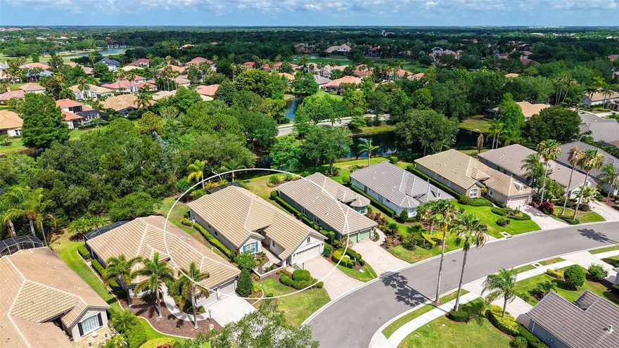 Located in the highly desirable community of Lakewood Ranch, this beautifully appointed Neal Burgundy floor plan blends timeless elegance with effortless Florida living. Showcasing a stunning Country French stone elevation, welcoming courtyard with fountain, and tranquil private lake views, this 3-bedroom, 2-bath residence offers 2,224 square feet of thoughtfully designed living space with an in-ground heated spa and exceptional upgrades throughout.
Step through double glass French front doors into an elegant foyer featuring square columns with applied molding, coffered ceiling with crown molding, and rich architectural detailing that continues throughout the home. Ceramic tile flooring flows through the main living areas, while elegant hardwood flooring enhances the den and owner’s retreat. The spacious den, accessed through double doors, provides the perfect flex space for a home office or media room.
Designed for both everyday living and entertaining, the gourmet kitchen is a chef’s dream featuring KitchenAid stainless steel appliances including a dual-fuel gas cooktop with double electric ovens, built-in microwave, refrigerator, and under-counter wine cooler. Gorgeous new quartz countertops, designer glass tile backsplash, staggered cabinetry, under-cabinet LED lighting, recessed lighting, vaulted ceiling, and glass block accents create a bright and sophisticated culinary space.
The inviting living room showcases a masterfully crafted custom built-in with shelving and designer speaker-style cabinetry, while crown molding, decorator niches, and refined finishes add warmth and character throughout. Both guest bedrooms, privatized by pocket door, feature luxury vinyl flooring and custom closets.
The serene owner’s retreat offers a bay-style sitting area, private lanai access, and coffered ceiling with crown molding. The spa-inspired primary bath features designer tile, jetted soaking tub, spacious walk-in shower, dual vanities with quartz countertops and undermount sinks, porcelain tile flooring, linen closet, and extensive storage.
Outdoor living is equally impressive with a peaceful lakefront setting, heated spa, electric awning for sunset enjoyment, and inviting lanai designed for year-round relaxation. Additional highlights include plantation shutters, central vacuum with kitchen sweep, exquisite lighting and fans, new epoxy garage flooring, laundry room with sink and new washer and dryer with portable counter, mounted den TV, and a new A/C installed in November 2023.
This exceptional home combines luxury, comfort, and timeless style in one of Lakewood Ranch’s most sought-after settings.