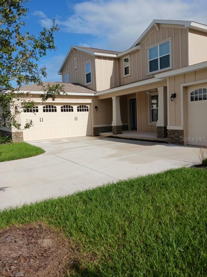 Fall in love with effortless elegance in this brand-new 2025 “Mulberry” floor plan, nestled in the heart of Calesa Township, Ocala. Never lived in and completed just before summer, this home shows like a model — with curated upgrades at every turn. A standout feature is the fully permitted, climate-controlled sunroom — perfect for morning coffee or cozy evenings year-round.
Inside, luxury vinyl plank flooring flows through open, light-filled spaces, complemented by recessed dimmable lighting, and ceiling fans added throughout the home for comfort and energy efficiency. The elegant upgraded front door sets the tone for the modern, welcoming design. Electrical enhancements include extra outlets inside and out, including soffit locations for outdoor lighting or décor.
The gourmet kitchen showcases solid-wood, soft-close cabinetry, seamless quartz countertops, under-cabinet lighting, and a farmhouse-style apron-front sink with Delta fixtures — combining functionality with timeless sophistication.
The bathrooms reflect spa-like tranquility with quartz counters, glass-enclosed tile showers, dual vanities, upgraded lighting, and thoughtful grab bars in the primary suite. The laundry room is fully upgraded with built-in cabinetry, quartz counters, sink, and washer/dryer pedestals. A tankless gas water heater with a recirculating pump, insulated supply lines, and plumbing for a future water softener bring modern efficiency and reliability.
The 8-foot insulated garage doors open to a finished garage featuring a Shark-coated floor for durability and a clean, polished look. Exterior features include hose bibs on all four corners and a gas line at the rear, ready for your grill or outdoor kitchen. Every finish and fixture was chosen with care, balancing comfort, technology, and aesthetics — making this home truly move-in ready.
Beyond the home, Calesa Township offers a lifestyle built around connection, recreation, and wellness. Residents enjoy miles of scenic multi-use trails, pedestrian tunnels, and lush greenways linking every neighborhood. Community amenities include a resort-style pool with sun shelf, splash pad, cabanas, playgrounds, basketball courts, a skate park, and separate small- and large-dog parks. Families benefit from the on-site K–8 charter school, while fitness enthusiasts can enjoy the state-of-the-art FAST Aquatic Center for swimming and athletic training.
Every detail in this Mulberry home exemplifies quality and care — blending thoughtful design, high-end finishes, and resort-style amenities into one stunning, turnkey residence that captures the essence of modern Florida living.