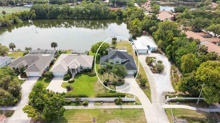 Located in a charming, low-HOA community (comprised of just 6 homes) in West Bradenton, this nearly 2,700 sq ft lakefront, pool home is a rare find.

This 4-bedroom, 3 full bathroom two-story home welcomes you with soaring cathedral ceilings in the main living area, creating an open and airy feel from the moment you step inside. A unique sunken living room adds character, while the freshly painted interior and newer flooring on the stairs and upstairs bedrooms provide a move-in ready touch.

The kitchen has been updated with newer stainless steel appliances and a stylish backsplash, making it both functional and inviting. A separate dining room offers the perfect space for hosting gatherings.

Upstairs, the private primary suite serves as a peaceful retreat with a balcony overlooking the lake, perfect for morning coffee.  The additional bedrooms provide plenty of flexibility for family, guests or multigenerational living, and there is a flex room that can easily serve as a 5th bedroom.  

Step outside and experience what truly sets this home apart—its picturesque setting on a shared 6-acre lake with spectacular sunsets every evening. Whether you’re kayaking or unwinding on the observation deck, the tranquil water views and abundant wildlife create a backyard experience that feels like a private escape. Ducks, pelicans, osprey, otters, and turtles are frequent visitors, bringing Florida's nature right to your doorstep.

The outdoor space is complete with a sparkling pool and a brand-new pool cage, perfect for enjoying Florida living year-round. A new roof (2025) adds peace of mind, while mature landscaping enhances the home’s curb appeal.

Ideally located close to restaurants, grocery stores, hospitals, and just minutes to the beautiful beaches of Anna Maria Island, this home offers the best of both worlds—everyday convenience with the feeling of being miles away from it all.  Walking distance to Bradenton Christian School, and just minutes to IMG academy.

Opportunities like this don’t come around often—schedule your private showing today and experience lakefront living in West Bradenton at its finest.