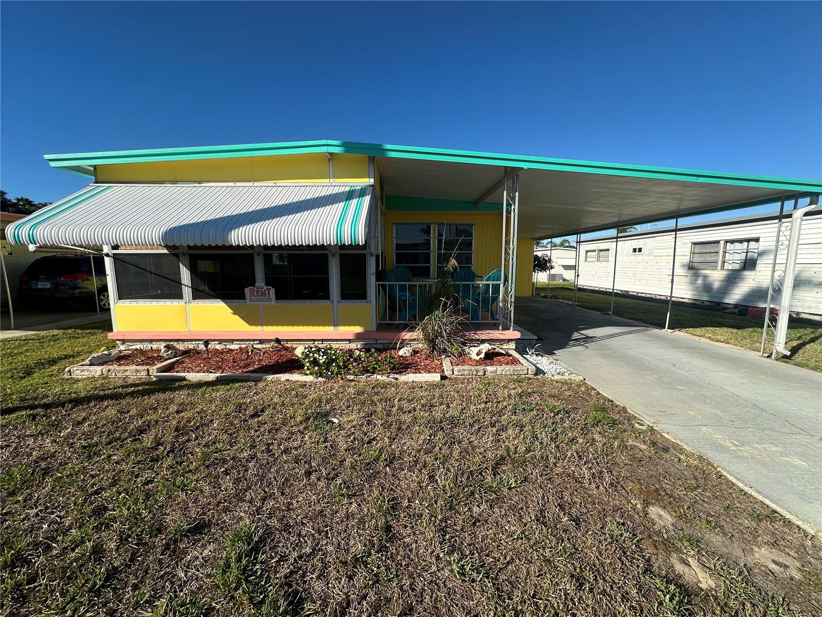 Welcome to Tarpon Shores 55+ Community!! Enjoy living in a vibrant community that feels like you are on vacation every day! Presenting a spacious 2 Bedroom 2-bathroom double wide manufactured home with an open floor plan plus a light and bright Florida room. This home is offered with refrigerator, range, microwave, and dryer. Recent updates include a NEW HVAC and NEW hot water heater. Situated outside of a flood hazard zone, this home remained high and dry from all past storm activity. Community Amenities include: Heated Pool, BBQ Grills, a Billiard Room, Covered Shuffleboard Courts, Bocce Ball Court, Pickleball Court, Horseshoe Pits and more!! Included in the monthly rental amount is water, sewer, trash, cable, internet, and exterior ground maintenance. Only emotional support animals with proper documentation are allowed.