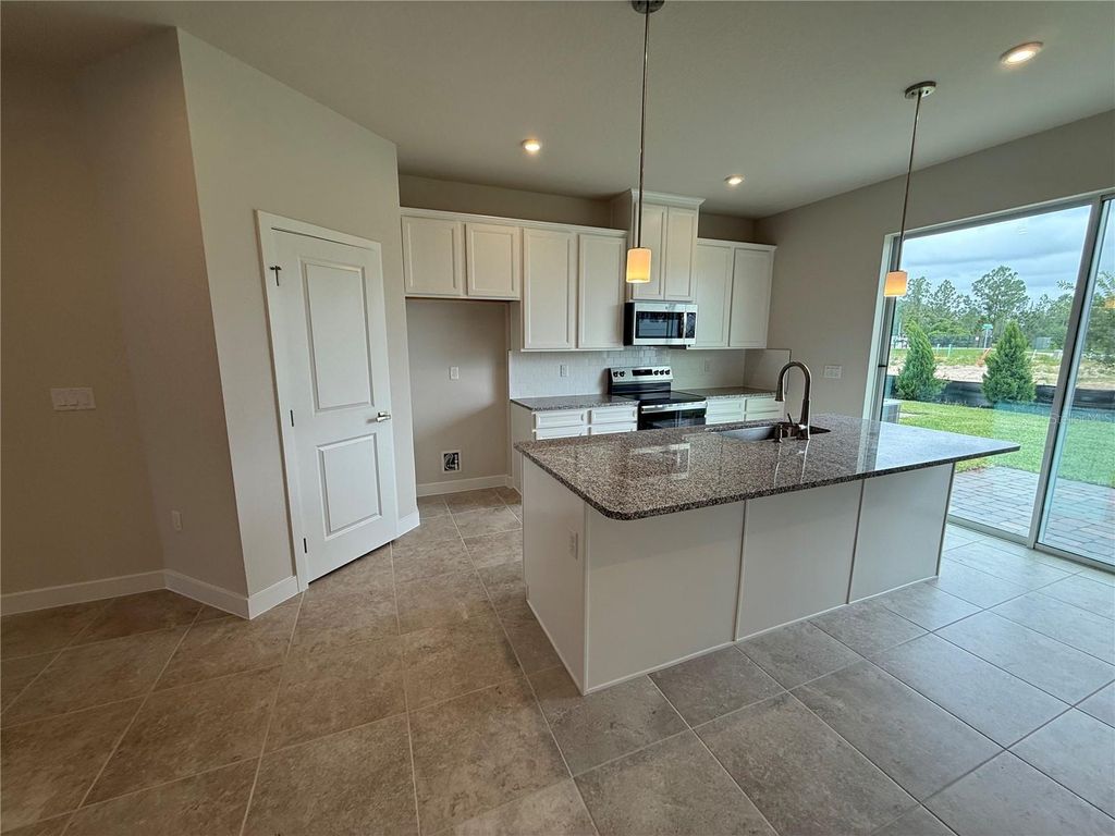 Photo of 1229 Pineywood Field Drive, Davenport, FL 33837 (MLS # W7885337)