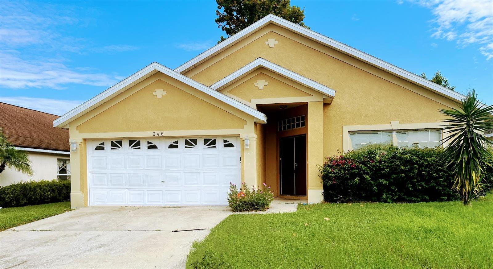 Welcome to 246 Queen Mary Drive, a well maintained 4-bedroom, 2-bathroom home nestled in the desirable Regency Place gated community in Davenport, FL. Offering 1,855 sq ft of open-concept living space, this home blends comfort, style, and convenience—all within minutes of I-4, Posner Park, shopping, and dining.
Step inside to find tile flooring throughout, high ceilings, and a bright, spacious floorplan featuring both formal living/dining areas and a cozy family room. The kitchen is well-appointed with ample cabinetry, breakfast bar seating, and modern appliances—perfect for family meals or entertaining.
The private primary suite includes a large walk-in closet and a spa-like en suite bath with dual vanities, soaking tub, and a separate tiled shower. Three additional bedrooms offer space for family, guests, or a home office.
Out back, a patio and fully fenced yard offer the perfect spot to relax or entertain. Community amenities include a swimming pool and playground, all with low HOA dues.