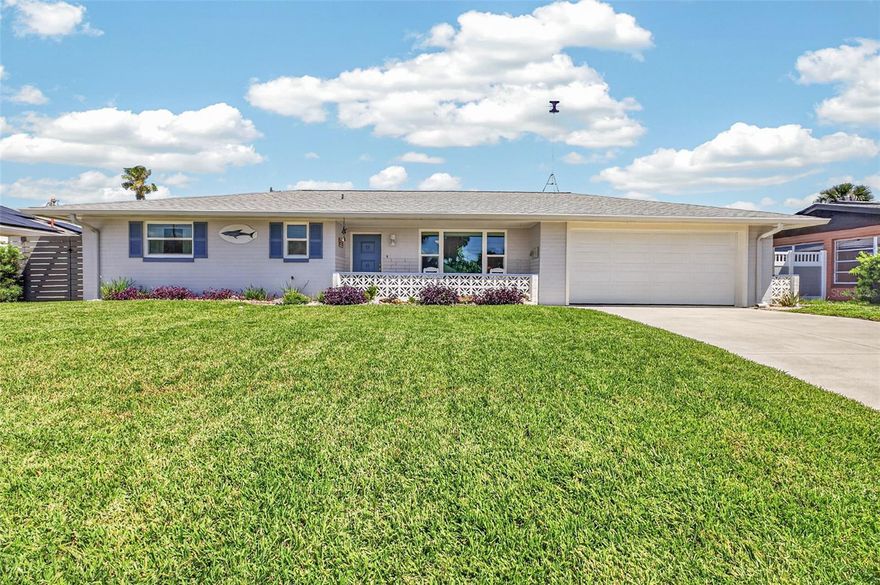 Under contract-accepting backup offers. Coastal Living at Its Finest in Ormond By The Sea!  Charming & Meticulously maintained 2-bedroom, 2 bath home with a spacious sunroom, perfectly positioned between the Intracoastal Waterway & the Atlantic Ocean--just a short 5-minute walk to both! GOLF CART is staying so you can load up the beach bag & have the true beach life. This light-filled home features an open floor plan ideal for relaxed coastal living. The updated kitchen showcases modern maple wood cabinetry, exotic granite countertops, and ample workspace for entertaining. Enjoy the convenience of an inside laundry room with a pass-through from the garage leading directly to the covered back porch--perfect for easy indoor-outdoor living. Recent upgrades include new windows and updated bathroom vanities with granite countertops, while preserving the timeless character of vintage tile work. Situated on a large lot with rare rear access, there's plenty of room for RV or boat storage, complete with a 30 AMP electric hookup. The private, fully fenced backyard offers a peaceful retreat with a supersized covered lanai and outdoor shower--ideal after a day at the beach. Don't miss this opportunity to own a slice of paradise in highly desirable Ormond By The Sea--where coastal charm meets modern convenience.  Meticulous FEATURES: ROOF (2023) , RV PLUG 30 AMP, NEW SEPTIC/DRAIN FIELD in front (8/2023) Covered lanai (11/22), Water Heater (2022), Fence (2021), Irrigation Pump & Well (2021), New Driveway (2018) Impact Windows (2017) Impact Garage Door (2017)