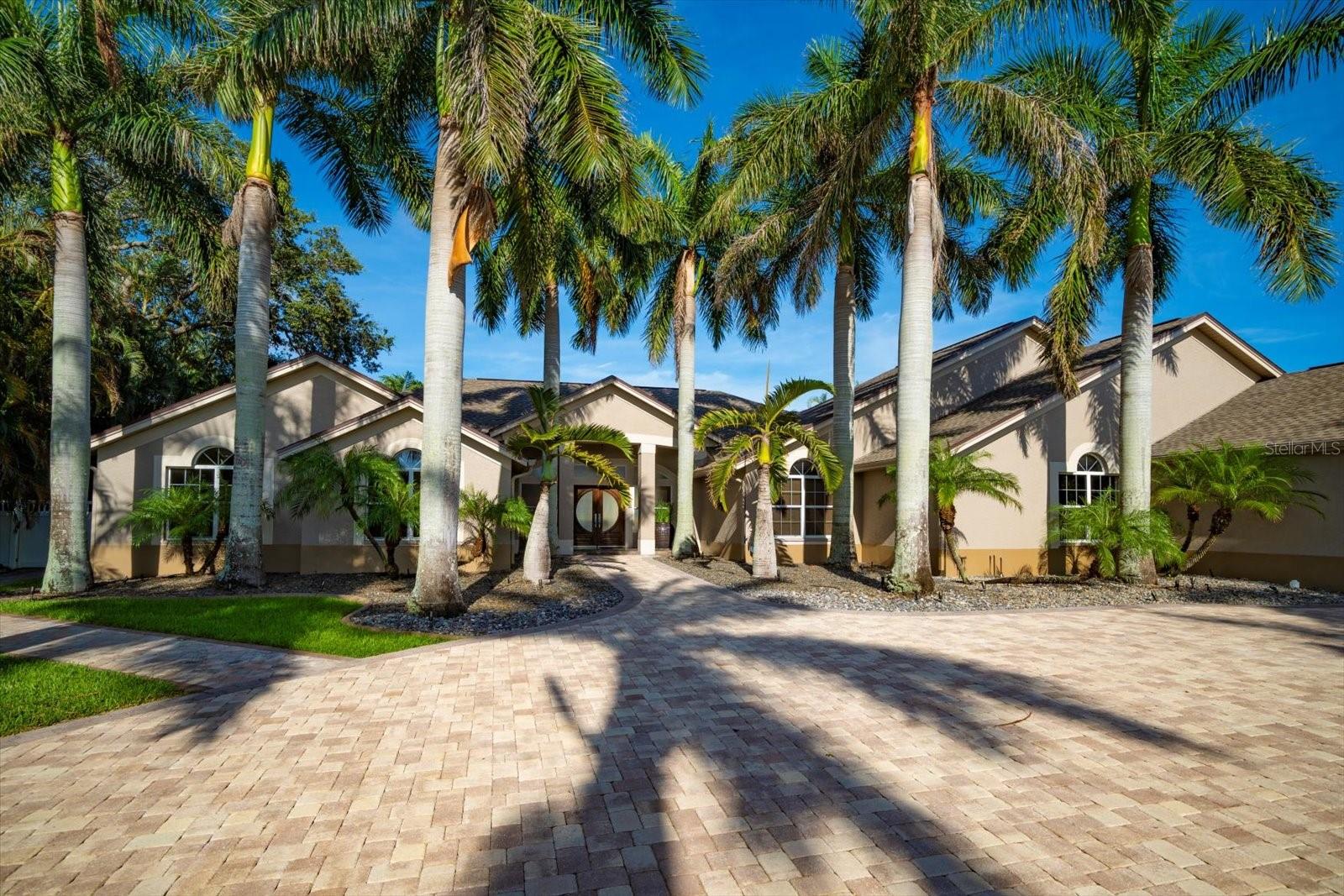 PRICE ADJUSTMENT! Impeccable home tucked high on a bluff, on just under 3/4 of an acre, has it all! From the moment you pull into the large, circular driveway, surrounded by majestic royal palms, you feel something special. As you enter the front door, your eyes will be drawn past the open Living Room/Dining Room area to a direct view of the pool and backyard. Built in a U shape, this home has a stunning pavered deck, Heated Salt Water Pool and Spa, Gas Fire Pit, a superb Outdoor Kitchen and Portico with ceiling fans offset by a magnificently manicured backyard ready for entertaining! The Gourmet Kitchen with Skylights and Custom Cabinets also overlooks the pool deck area. Fully equipped with a Wolf Double Oven, a Thermador Cooktop and Dishwasher, a Subzero Refrigerator and a Wine Refrigerator is a Chef's Delight! The Kitchen opens to the Family Room with vaulted ceilings, Gas Fireplace and sliders leading to the pool area. Just beyond the family room is a bedroom with its own en suite bath, walk-in-closet and sliders. Also, on this side of the home are two additional bedrooms and a full bath. On the other side of the home, the Primary Suite opens with sliders to the pool area and has a private Bath with jetted Soaking Tub, huge Walk In Shower and Walk In Closet. Next to the primary bedroom there is an oversized bedroom with double doors. And that’s not all the new addition consist of an Office, Bedroom with ensuite bathroom (Handicap assessable) and a large flex area with French doors leading to a private area with a walkway to the pool. This home has a total of 6 bedrooms, 4 full baths and a three-car garage. (4703 Sq Ft of living area) In addition the home is equipped with a Tankless Water Heater, whole house Kohler generator and a split system AC in garage. Roof 2021 Designed for entertaining. Close to beaches, shopping and restaurants. This home is a must see! NOT IN A FLOOD ZONE!