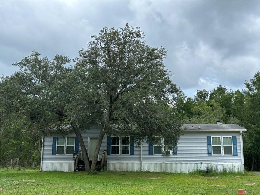10 ACRES, PAVED ROAD AND ROOM TO MAKE IT YOUR OWN!! --- $259,900
Bring your vision—and maybe your toolbox—and turn this 3-bedroom, 2-bath home into the private country retreat you’ve been dreaming about. With 1,680 sq ft of living space, this spacious 2005 mfg home boasts a family room with a cozy fireplace, a separate living room, and a split-bedroom layout, there’s plenty of room to spread out. The open floor plan makes everyday living easy and gatherings even better.
Step outside to a 12x20 covered porch and 12x26 deck—perfect for watching sunsets, sipping coffee, or hosting weekend get-togethers. The 10 fully fenced acres give you space for animals, gardens, or simply privacy. Extras include a well house, greenhouse, irrigation system, and more.
Yes, it needs some updates—roof, HVAC, flooring, and a deep clean—but it is priced to leave room for your improvements. No HOA, no deed restrictions, and endless freedom to shape this property into something truly yours.
If you’ve been waiting for acreage on a paved road with value you can unlock, this is the one to see.
Conveniently located between Williston and Bronson, with an easy commute to Gainesville or Ocala.
Come experience pure country living in the Gateway to the Nature Coast!