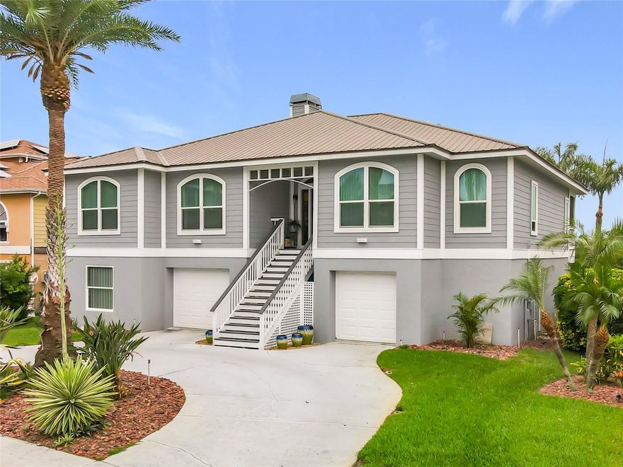 Welcome to your own slice of waterfront paradise in the highly sought-after Pointe Alexis community, where elevated coastal living harmonizes with luxury comfort and everyday tranquility. From the moment you arrive, this beautifully maintained and thoughtfully updated home makes an unforgettable impression with its striking curb appeal, tropical landscaping, and timeless metal roof.

Step inside to discover soaring ceilings, rich wood flooring, and abundant natural light that fills the open-concept living spaces, creating a warm yet inviting atmosphere. The impressive great room is the heart of this home, designed for making cherished memories with family and friends. With its inviting layout and breathtaking coastal backdrop, you can admire stunning water views from nearly every angle, creating the perfect ambiance for relaxation, entertainment, and unforgettable gatherings.

The stunning chef’s kitchen, a seamless extension of the great room, features extensive custom cabinetry, granite countertops, stainless steel appliances, gas range, oversized breakfast bar seating, and exceptional storage—ideal for both entertaining and daily living.

Enjoy the seamless transition to the screened-in patio area, where you can relax while taking in panoramic views of the intercoastal—perfect for outdoor dining or unwinding in your own private retreat. The spacious primary ensuite is a true sanctuary, featuring ample room and those captivating "pinch-me" views, ensuring every morning feels like a dream come true.

Venture downstairs to discover an open canvas waiting for your personal touch—perfect for a home office, gym, or additional storage, allowing you to customize the space to fit your needs.

Pointe Alexis provides a true resort-style lifestyle with access to a clubhouse, community pool, tennis courts, and impeccably maintained surroundings—all just minutes away from beautiful beaches, marinas, waterfront dining, shopping, and the renowned Tarpon Springs Sponge Docks.

Whether you seek a full-time coastal retreat or the ultimate Florida getaway, this exceptional waterfront home delivers the perfect blend of elegance, comfort, and vibrant lifestyle—an extraordinary opportunity to live the life you’ve always dreamed of.