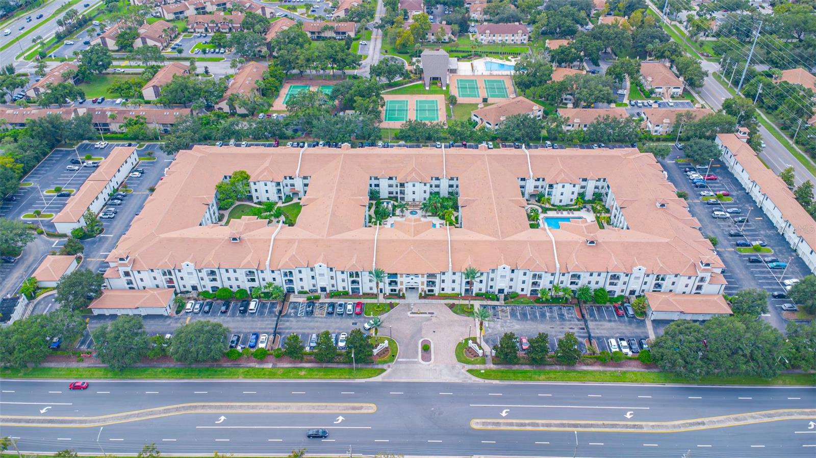 Exceptional Ground Floor 2-Bedroom Condo with Deeded Garage in The Registry at Michigan Park (Gated Community)! Welcome to Unit #2106 – a rare and highly sought-after ground-floor 2-bedroom, 1-bath condo located in the prestigious Registry at Michigan Park. This end unit stands out for its private deeded garage (a rare find in the community!) and prime courtyard location, offering the perfect blend of comfort, convenience, and style. Step inside to an open-concept floor plan featuring a spacious kitchen with abundant cabinetry, generous counter space, and a breakfast bar ideal for casual dining or entertaining. The kitchen seamlessly flows into the bright dining and living areas, enhanced by a sliding glass door that opens to your private lanai – perfect for enjoying Florida's sunshine and peaceful courtyard views. The thoughtful “double master” layout offers two well-sized bedrooms with a large, centrally located bathroom, ideal for both residents and guests. This layout provides exceptional flexibility for homeowners, roommates, or visitors. As a resident of The Registry at Michigan Park, you’ll enjoy resort-style amenities, including: Two heated pools and spa, A state-of-the-art fitness center with yoga room, Clubhouse and great room available for private events, Business center and conference room, Secure, gated community with beautifully maintained grounds, The HOA covers almost everything: cable TV, high-speed internet, water, sewer, trash removal, pest control, exterior maintenance, and full access to all amenities. Located in the heart of Orlando, you're just minutes from downtown, Orlando International Airport, UCF, Full Sail University, top-rated schools, hospitals, shopping, dining, golf courses, and world-renowned theme parks and beaches. Whether you're a savvy investor (this unit has maintained a history of strong rental income since 2005) or a future owner-occupant seeking hassle-free living in a vibrant, gated community — this is a rare opportunity not to be missed. Truly a turnkey gem in a resort-style community!