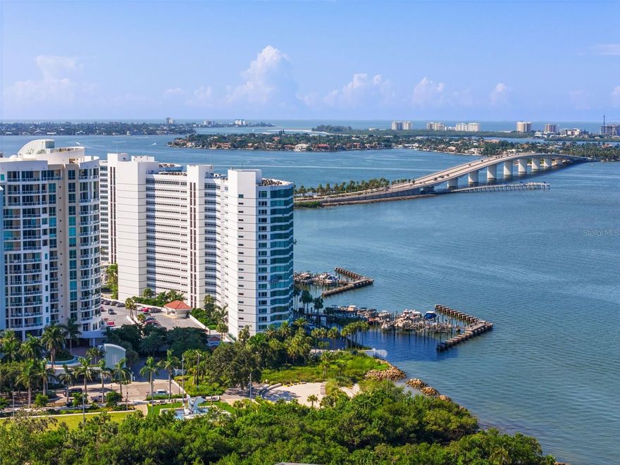 One or more photo(s) has been virtually staged. Priced to sell!!!  Don't miss this opportunity to live in one of the most Extraordinary Waterfront Residences at Condo on the Bay, a Premier, Gated Community directly on Sarasota Bay. This Beautiful, Luxury Condominium is Where Architecture Meets Designer!
The complete renovation with Professional Designs from a Well Renowned Designer who focused on high-end finishes, modern aesthetics and enhanced convenience created a very sophisticated and stylish living space. Click on the Virtual Tour Link on the first picture of the listing.

Location is Everything and this very desirable mid-building location offers not only the breathtaking panoramic views that stretch across the sparkling Bay to the Ringling Bridge and Longboat Key, but also offers the bonus of watching boats passing by and the opportunity to observe the active marine life with soaring pelicans and the frequently seen dolphin frolicking in the Bay.
This Van Gogh unit with its modern open floor plan offers wall to wall windows and expansive sliding glass doors, filling every room with sunlight. No detail was missed and no expense spared with this renovation, including tankless water heater, full house filtration system and RO drinking water filtration system. The custom cabinetry, porcelain tile floors, elegant hardware and lighting fixtures along with the upscale kitchen appliances offers a kitchen appealing to the gourmet chef or the casual entertainer. The primary suite is a serene retreat, with its own private terrace also with stunning Bay views, an elegant ensuite bath with double vanity and oversized shower, offering a spa-like escape. The second bedroom doubles beautifully as a guest room or office/den, outfitted with a convenient queen Murphy bed and wall to wall windows. 

Beyond your door Condo on the Bay offers many amenities: two heated swimming pools, a grilling station, private boat docks with fishing stations, tennis and pickelball courts, two fitness centers, elevated sky lobbies perfect for your larger gatherings or just to enjoy the sunset. Each Tower has a social room equipped with a full kitchen where planned events happen regularly if you want to meet your neighbors. There is assigned lower garage parking with abundant upper deck guest spaces plus EV charging stations.

Perfectly located next to Sarasota's new 40-acre waterfront park, The Bay, The Van Wezel Performing Arts Center and minutes from downtowns vibrant dining and shopping, The Rosemary District, and the nearby St. Armands Circle, Lido Beach and the SRQ Airport. All just a short drive away! 

Condo on the Bay is more than a luxury residence; it's an invitation to embrace the very best of Sarasota's waterfront lifestyle.