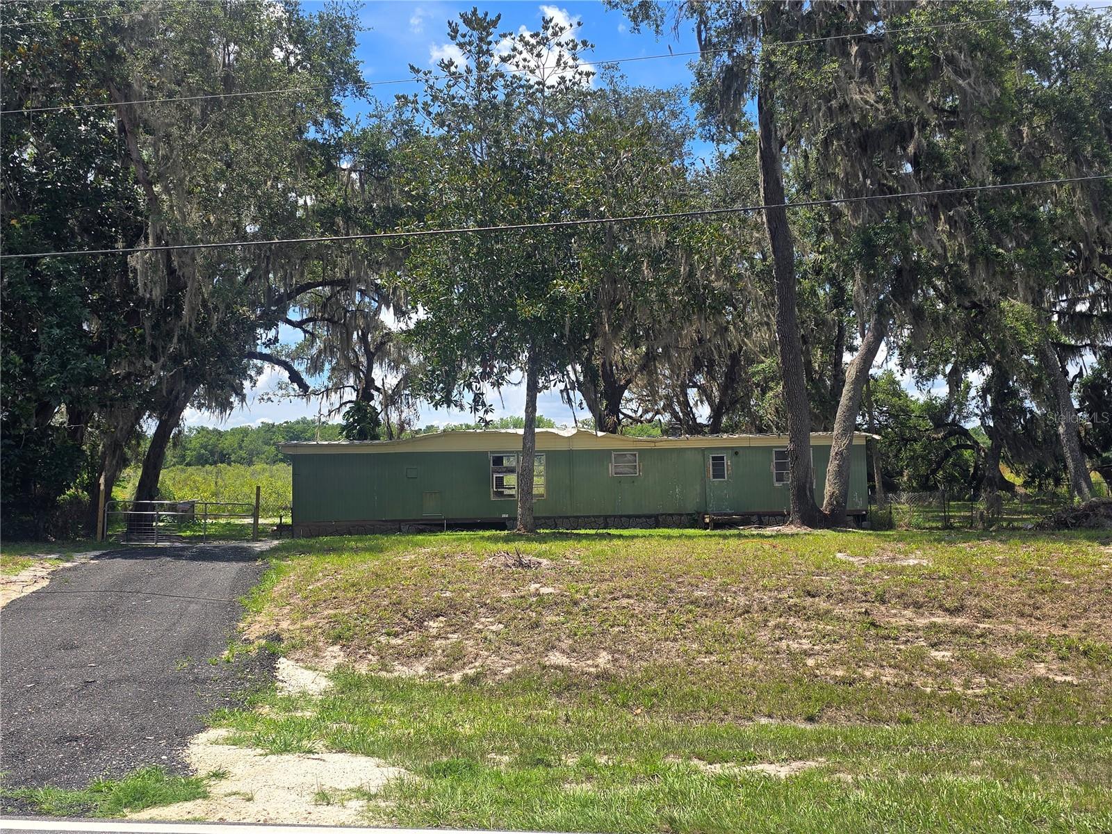 Take advantage of this unique opportunity near the scenic Tsala Apopka Chain of Lakes. Offering approximately 100 feet of canal and lake frontage, this property features natural surroundings and serene water views. Existing improvements, including a mobile home, provide potential for renovation or redevelopment—ideal for creating your future lake retreat. Whether you envision a quiet weekend escape or a new home project, this location offers a beautiful setting to bring your plans to life.