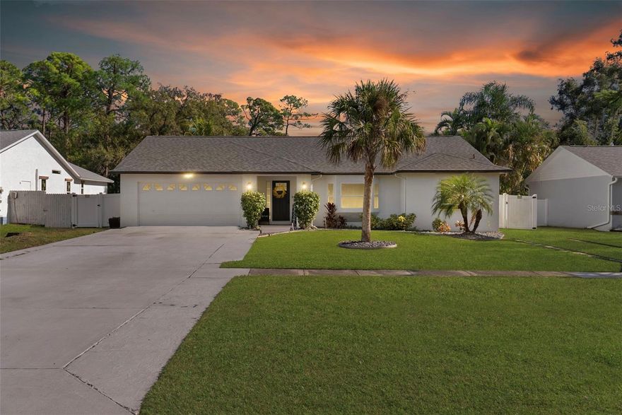 Welcome home to this 3-bedroom, 2-bath, 2-car garage residence located in the desirable Cedar Woods neighborhood of Pinellas Park. Set on a spacious, fully fenced lot backing to protected wetlands, this home offers exceptional privacy with no rear neighbors and peaceful natural views.

The west-facing property delivers stunning sunset views and features an enclosed rear patio, fire pit, and ample space with pool potential, making it ideal for outdoor entertaining or future customization. The oversized yard provides flexibility for relaxation, recreation, or expansion.

Inside, enjoy an airy, open-concept layout anchored by a chef’s kitchen that flows seamlessly into the living area—perfect for everyday living and hosting. Thoughtful upgrades include hurricane impact doors and windows (2022), updated plumbing, AC (2021), and roof (2021), offering peace of mind and improved energy efficiency.

Conveniently located near shopping, dining, and major roadways like I-275 and US-19, making commutes and errands convenient. This move-in-ready Pinellas Park home combines privacy, functionality, and long-term value in a sought-after setting.