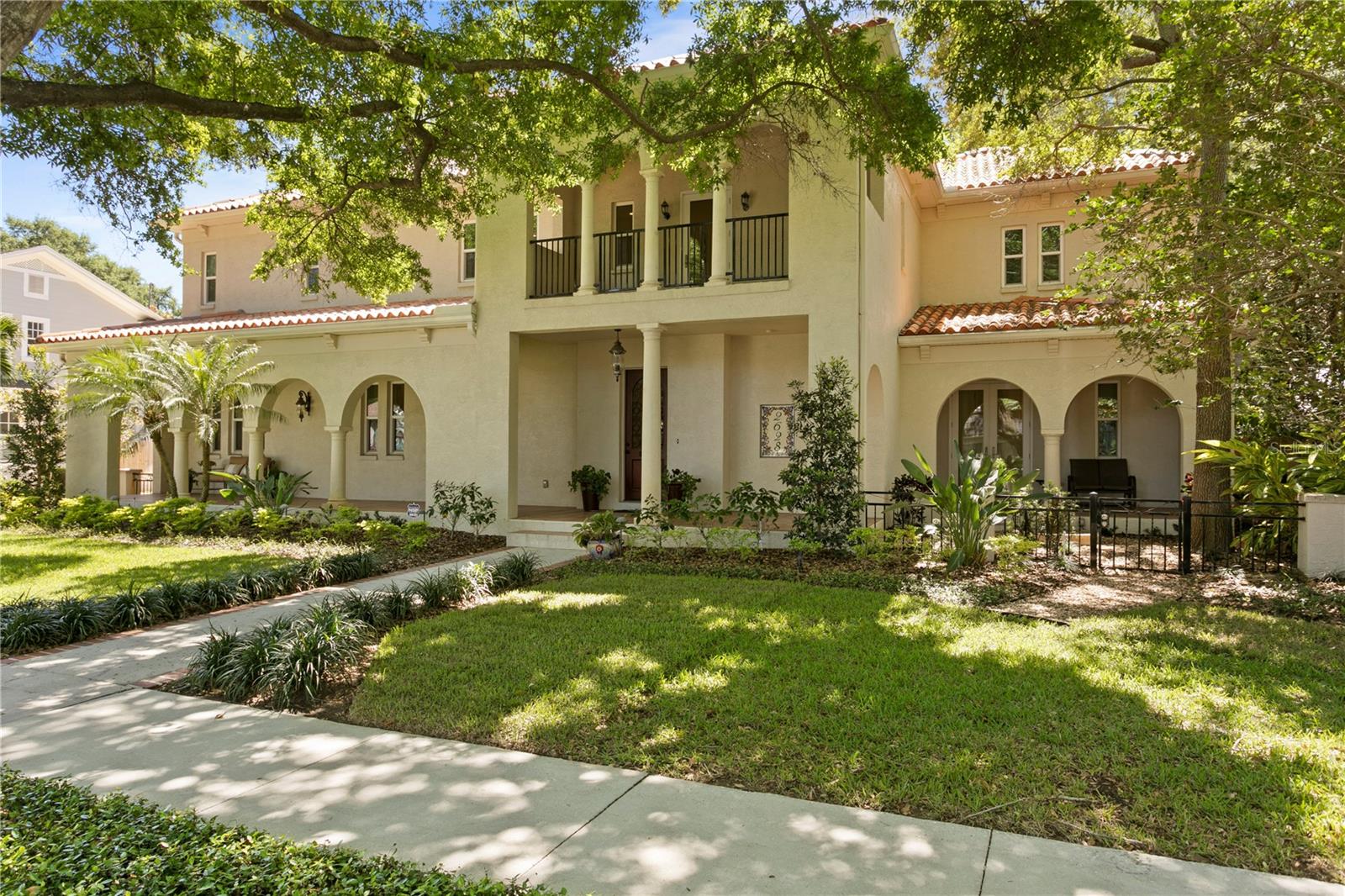 Check out the video! https://player.vimeo.com/video/810904395
Located in one of South Tampa’s most coveted neighborhoods, New Suburb Beautiful, this majestic Mediterranean-style home is the one you’ve been waiting for! Set under a stunning canopy of oak trees and thoughtfully laid out on an oversized (11,935 sf) lot, this expansive 5 bedroom, 5 bath pool home offers 5,200+ sq ft of living space and creates the perfect, welcoming environment for entertaining all of your family and friends. Built in 2002 and inspired by Southern California architectural style, this high-quality home includes solid block construction, newly installed impact rated windows and doors, 10’ ceilings, 8’ solid core doors, ash wood floors, and a garage/pool house. Multiple balconies, terraces and courtyards highlight the thoughtful design and provide the perfect spaces for maximizing your Florida lifestyle.
The open layout on the first floor provides the perfect set-up for entertaining family and friends for all occasions. As you enter, you will notice the stately foyer and spacious living/dining area that conveniently share a double-sided gas fireplace perfect for creating special memories with loved ones. The kitchen is ideally situated with views of the backyard oasis and features custom wood cabinetry, granite countertops, Thermador 6-burner gas range, abundant storage and an eat-in breakfast area. Connected to the kitchen is a casual living space with built-in entertainment center and bar providing the perfect space for cocktail parties or cozy movie nights.
A set of glass French doors lead you into a generously sized office space with custom built-in bookshelves that is large enough to accommodate a work space for everyone in the family. Tucked away down a separate hallway is a downstairs guest suite with privacy from the second floor bedrooms and access to the backyard through a set of French doors.
Upstairs, the generously sized master suite opens to a screened patio overlooking the lush yard and is the perfect serene place to begin your day. The master suite also features tray ceilings with special lighting, two walk-in closets, a relaxing bath with soaking tub, a stand-in shower and additional flex space that can serve as a home gym or extra storage. The second and third bedrooms share a jack and jill bath, while the larger fourth room upstairs has an ensuite bath. Upstairs you will also find a conveniently located laundry room and a large open flex/upstairs family room space with access to another beautiful covered terrace off the front of the home.
The beauty of the interior integrates seamlessly with the thoughtfully designed, resort-style backyard with heated pool, covered back patio, open air pergola with fire pit, outdoor gas grill and 552 sq. ft. pool house with full bath and wet bar creating the perfect setting to enjoy those long summer days. Other features of the home include: Abundant interior storage space throughout the house, newer HVAC system, a jet stream in the pool for fitness swimming, custom front door storm protector, an electric vehicle charger installed in the garage, and a uniquely spacious driveway and garage designed to park multiple cars.
The best part is your new home is located right in the heart of S. Tampa and within walking distance of some of Tampa's best restaurants, Hyde Park Village, Palma Ceia Golf & Country Club and Bayshore Boulevard in addition to A+ rated schools (Mitchell, Wilson, Plant).
