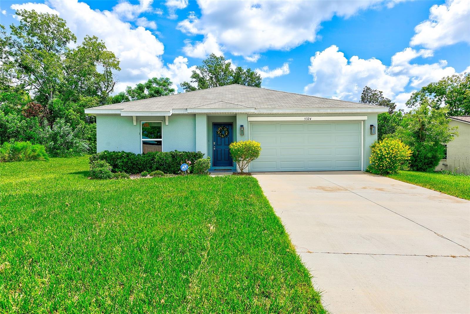 Welcome to your dream home at 5324 Delbrook Ave, where modern elegance meets everyday convenience! This beautifully maintained, concrete block residence, built in 2022, boasts 4 spacious bedrooms and 2 well-appointed bathrooms, making it the perfect haven for families or those who love to entertain. Say goodbye to HOA and CDD fees, giving you the freedom to personalize your property as you see fit!
Step inside and be greeted by a stylish open floor plan that creates an inviting atmosphere, ideal for contemporary living. The heart of the home features stunning grey shaker-style kitchen cabinets, complemented by exquisite granite countertops and high-quality stainless steel appliances—perfect for culinary enthusiasts and family gatherings. Smart home features enhance your peace of mind, including pre-wiring for ADT smoke detectors, a doorbell camera, and a garage opener, all designed to make your life easier and more secure.
The spacious layout is accentuated by ample closet space, elegant tile flooring in the main living areas, and plush carpeting in the bedrooms for added comfort. The front bedroom, conveniently located, is versatile enough to serve as a home office, complete with beautiful built-in bookcases that add a touch of sophistication.
Step outside to discover a large backyard that offers endless possibilities. Imagine creating your own outdoor oasis with a patio for entertaining, a pool for summer fun, or simply a tranquil space to unwind and enjoy the Florida sunshine.
Ideally situated near schools, shopping centers, and major highways, this home provides effortless access to Tampa and surrounding areas, as well as local beaches and exciting events. Don’t miss out on this exceptional opportunity to own a slice of paradise in Spring Hill. Schedule your showing today—this beautiful home won’t last long!