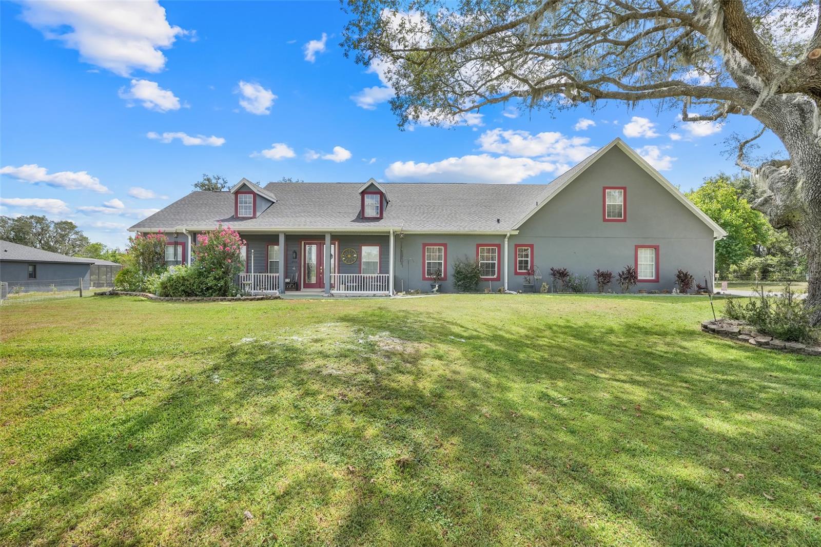 Welcome to your dream home in a quiet gated community of custom homes, where country charm meets convenient living. Situated on over an acre of land, this 4-bedroom, 3-bathroom residence offers nearly 3,200 square feet of living space designed for comfort, entertaining, and everyday luxury. Step inside to find a bright, open floor plan with multiple living areas including a formal den/office, a game room, and a huge upstairs bonus room—ideal for a guest suite, home theater, or playroom. The kitchen is a chef’s delight, featuring new appliances, granite countertops, and plenty of cabinet space. Enjoy Florida living at its finest with a large screened-in lanai, a sparkling pool with jacuzzi, and no rear neighbors—offering both privacy and tranquility. The fully fenced yard, shed, and carport provide added storage and utility, while the 4-car garage and 50 amp hook up for your RV are perfect for car enthusiasts or travelers. This unique property offers the peace of country living with the convenience of being just minutes from town. Schedule your private tour today!