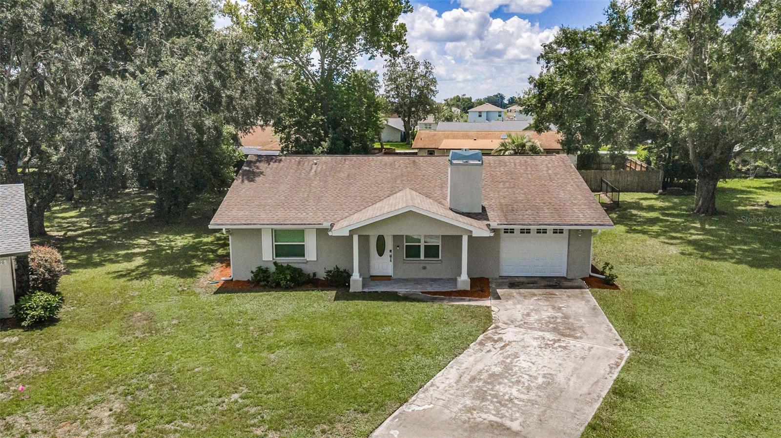 Under contract-accepting backup offers. Like-New Living in Brooksville! Welcome to this beautifully rebuilt 2-bedroom, 2-bathroom, 1-car garage home, IN A NON-FLOOD ZONE(!), tucked away on a quiet cul-de-sac in the heart of Brooksville. Sitting on a generous quarter-acre lot, this property offers both privacy and space, while being part of a peaceful neighborhood setting. Completely rebuilt in 2019, this home lives like new with modern block construction, a thoughtful open-concept layout, and quality finishes throughout. The spacious kitchen features granite countertops, ample cabinetry, a gas cooktop, and a seamless flow into the dining area and living room featuring a gas fireplace — perfect for everyday living or entertaining. The primary suite is a true retreat with a large built-in closet, dual vanity, and private sliding door access to the oversized screened-in porch—ideal for morning coffee or evening relaxation. The second bedroom and bathroom provide comfort for guests or a home office setup. Enjoy Florida living year-round with the expansive screened porch and the sizable backyard, offering plenty of space for gardening, pets, or future projects. And the property line extends beyond the fence line! With a prime location close to local shops, dining, easy access to major roadways, and a half mile from Sherman Hills Golf Club, this property combines modern convenience with cul-de-sac tranquility. Move-in ready and it won't last long so don’t miss your chance to make it yours!