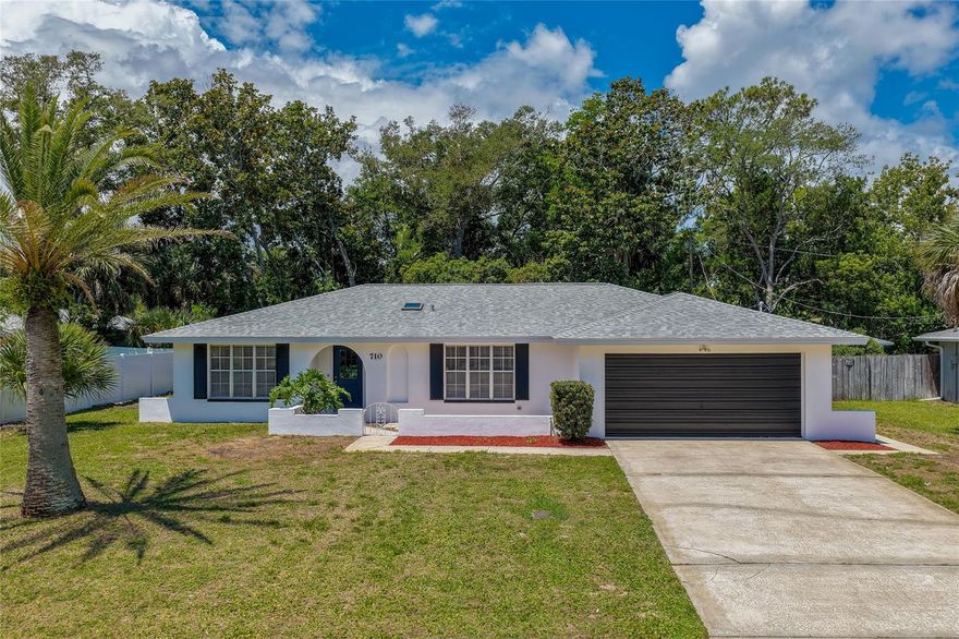 One or more photo(s) has been virtually staged. This completely remodeled 3-bedroom, 2-bathroom home in the Woodmere community offers approximately 1,958  square feet of thoughtfully designed living space with modern finishes throughout. A short distance from the Tomoka State Park and the Loop. New AC 2024 and roof 2019. Inside, the open-concept layout creates a seamless flow between the living, dining, and kitchen areas, enhanced by recessed lighting, oversized windows, and luxury vinyl flooring throughout the home. The remodeled kitchen features stainless steel appliances, quartz countertops, abundant cabinetry, pendant lighting, and a large center island with seating. Just beyond the main living space, the enclosed sunroom offers an inviting extension of the home with expansive windows overlooking the backyard, creating the perfect setting for a secondary living area, reading room, game room, or home office. The primary suite features a bright and airy design with generous closet storage. The remodeled primary bathroom includes a vanity with a quartz countertop, modern fixtures, and a walk-in shower with stylish tile finishes. Additional bedrooms are comfortably sized and offer flexible living arrangements for guests or workspace needs. A dedicated laundry room with built-in shelving and a utility sink adds convenience and storage. Outdoor living continues with a patio overlooking the spacious backyard with mature trees and plenty of room for outdoor gatherings, gardening, or recreation. The property also includes an attached 2-car garage, and a detached storage shed. With no HOA, homeowners can enjoy added flexibility and fewer restrictions. This premium location is just steps from the Intracoastal and close to the beach, fine dining, shopping, and entertainment. All information recorded in the MLS is intended to be accurate but cannot be guaranteed.