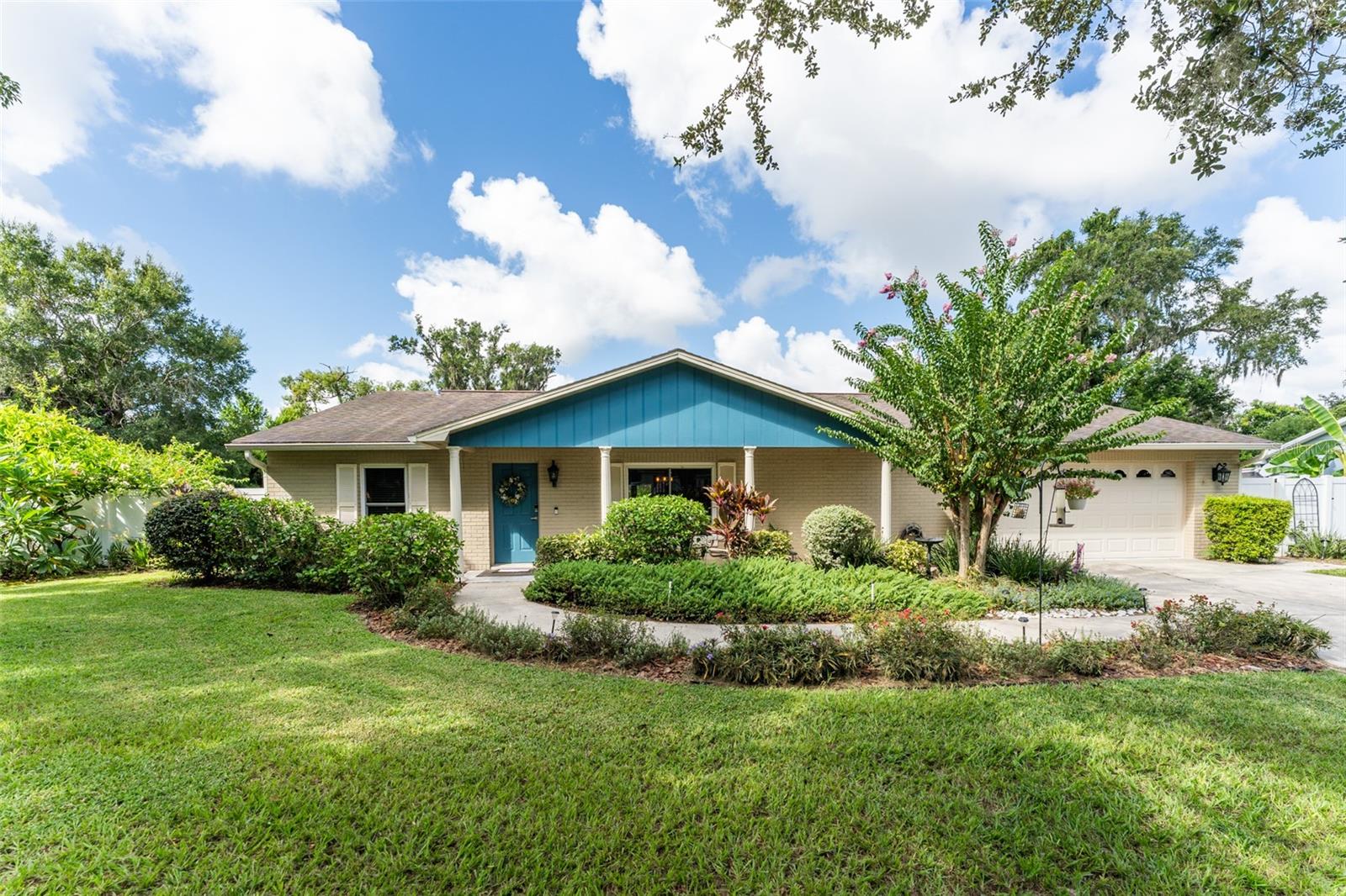 If you have been waiting for an appealing, well built one story Ranch home with NO HOA on a large fenced 1/3 acre lot in a super convenient Brandon location with great schools then this is the perfect home for you!! This lovely home is located on a quiet cul-de-sac street so no through traffic. You will notice the lush curb appeal as soon as you arrive. As you walk up to the front door, you will be welcomed by a cozy covered front porch. Step inside the home onto laminate flooring that flows throughout the home with tile in all wet areas. You will be greeted with a foyer into an open concept, spacious great room with access to the screen covered lanai via french doors and a more formal dining area overlooking the front yard. Adjacent to the great room area is the retro kitchen with newer SS appliances (2020) and a cheerful, light infused dinette area with french door access to the back covered lanai. The home features a split bedroom plan with the primary suite off the kitchen featuring a large walk in closet & updated Ensuite bath. The spacious secondary bedrooms are located on the opposite side of the home with the second updated bath in between. Other notable features include a 2 car oversized garage with new door & new opener, laundry room with washer & dryer, utility sink with cabinet, NEW Water Heater 2024, spacious & inviting screen covered lanai with new epoxy flooring that overlooks the backyard with gorgeous colorful shrubbery making this backyard oasis private & peaceful, newer windows, new irrigation, new gutters & a septic system in place of public sewer providing substantial savings on your water bill. Homes like this one do not come along very often, so make your appointment to see it today!!