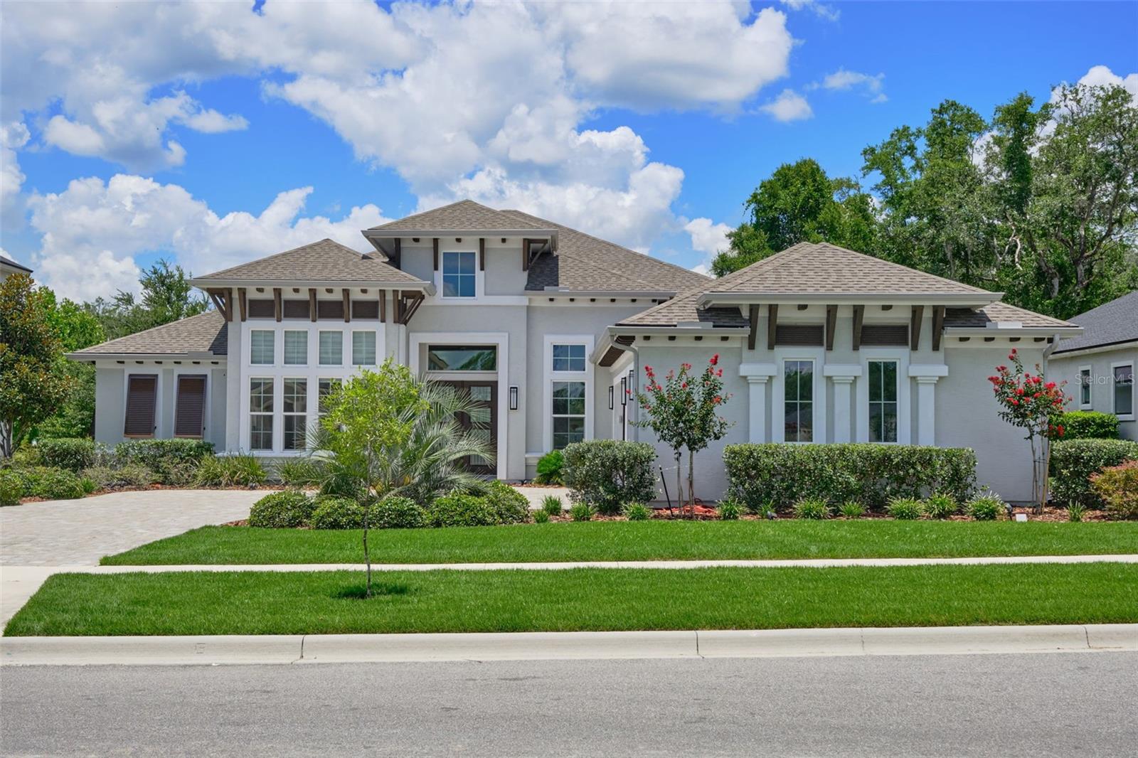 Welcome to this luxurious, thoughtfully upgraded ICI Egret V model in the highly desirable Oakmont community. This 4-bedroom, 3-bathroom home with a private office and 3-car garage sits on one of the most breathtaking premium preserve lots in the neighborhood.
At the heart of the home is a gourmet chef’s kitchen, featuring top-of-the-line stainless steel appliances, quartz countertops, custom cabinetry, and designer lighting—perfect for both daily living and entertaining. The open floor plan is enhanced with porcelain tile throughout, crown molding, and upgraded lighting fixtures for a cohesive, high-end aesthetic.
Step into the expansive great room and slide open the glass doors to create a seamless flow to your screened-in lanai. Here, you’ll find a stunning in-ground 30x15 pool and 8x8 spa with a clear view enclosure, offering uninterrupted views of the Oakmont Nature Preserve—ideal for relaxing or entertaining in style.
The owner’s suite is a serene retreat with preserve views and a spa-style bathroom featuring floor-to-ceiling tiled shower walls and upgraded finishes. Oversized custom mirrors in the dining and dressing rooms add a touch of elegance and space.
Residents enjoy resort-style amenities: community pool, fitness center, tennis courts, playgrounds, trails, and clubhouse—all just minutes from UF/Shands, Celebration Pointe, and top-rated schools.