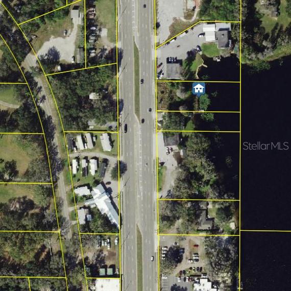 Located in the heart of Land O Lakes on the bustling US-41 corridor, 4538 Land O Lakes Boulevard presents a rare opportunity for developers or investors seeking a prime commercial site. Spanning .6571 acres, this lakefront parcel offers both visibility and scenic value making it a standout choice for businesses looking to blend functionality with aesthetics. With minimal vegetation and flat, well-drained terrain, the land is essentially construction-ready, offering significant savings on site preparation and permitting. Its strategic location just north of the FL-54 interchange ensures steady traffic flow and excellent exposure, ideal for retail, office, or mixed-use development. As the region continues to grow, this high-potential property offers both immediate usability and long-term value. If you're looking for a build-ready, waterfront lot in one of Pasco Countys most dynamic corridors, this is the one to secure.