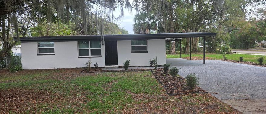 3-bedroom, 2-bathroom home with a split floor plan and an open layout connecting the living, dining, and kitchen areas. The kitchen features solid surface countertops. The primary bedroom includes an en-suite bathroom. Two additional bedrooms provide flexibility for various uses.
The home offers modern upgrades, a refreshed interior, and a new roof. Exterior features include a paver driveway and a yard suitable for relaxing or gatherings. Conveniently located near shopping, dining, schools, and major roadways. All measurements are approximate and should be verified by the buyer.  ***** Additional photos and video coming soon.