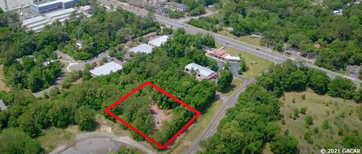 With just over 205 feet of frontage on SW 63rd Blvd and less than 1,000 ft from the Archer Rd and SW 63rd Blvd Intersection, this lot is a perfect location for you to build your new business. It is zoned Manufacturing and Processing Industrial (MP) with future land use for Heavy Industrial. Among permitted uses, Business and Professional Services are permitted. The owner has obtained access to the lift station for sewer through Archer Road Commerce Park; the sewer line has been run with the ability to connect to the lift station. This lot is only 1.5 miles west of I-75 and is located in SW Gainesville, just across from Kanapaha Station and down the road from Celebration Pointe, Butler Plaza, and UFHealth/Shands.
