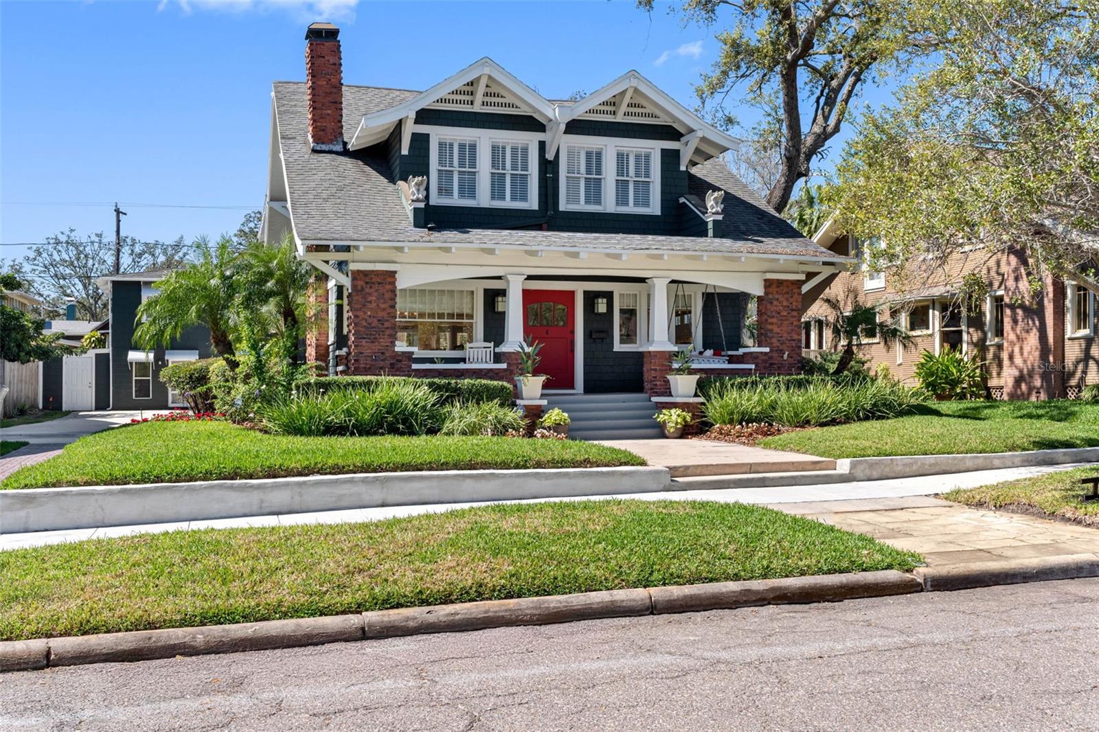 Welcome to this beautifully restored move-in ready bungalow, perfectly positioned 5 doors from Bayshore Blvd and 2 blocks from Hyde Park Village. BRAND NEW ROOFS and SELLER FINANCING available. This home offers 4 bedrooms, 4 full baths, a cocktail pool/spa, plus a 2-story carriage house containing two apartments. The welcoming porch affords a view of the water and is a perfect spot for gathering with friends or neighbors. Upon entering through the 48” Craftsman front door you'll notice the abundance of natural light. Eye-catching refinished heart-of-pine wood floors lead into the open floor plan. Box beam ceilings, custom millwork, judges panels, crown molding, and built-ins can be found throughout. FIRST FLOOR:As you step inside, you’ll find the living room with a gas fireplace followed by a large dining room, which then opens to the recently remodeled (2023/24) chef’s kitchen. It features high-end appliances such as the Italian Ilve gas stove/double oven, and adjoins an eat-in breakfast area. Dozens of cabinets for storage, a liquor cabinet, wine refrigerator, full bathroom, and large laundry room with new LG washer-dryer and a second full-sized refrigerator are conveniently located in the center of the first floor. The kitchen overlooks the sizable family room, where a set of French doors lead out to your own piece of paradise: the back lanai with a heated pool/spa, surrounded by tropical landscaping that provides privacy from the neighbors. SECOND FLOOR: Upstairs are four light-filled bedrooms, each with plantation shutters, walk-in closets, and built-ins. The master bedroom’s en suite bathroom has a dual-sink vanity, marble floors and countertop, a seamless glass shower, and a large soaking tub for ultimate relaxation.The second bedroom is en suite. Bedrooms 3 and 4 share a large third bathroom with dual sinks. ADDITIONAL FACTS The two-story carriage house (separate entrances), has been grandfathered to allow for rental, offering potential for additional income. The fully updated first floor unit may have garage conversion options. Both units have new LG all-in-one washer-dryers. The house also features two sheds for storage, a covered area to park a golf cart, and a Tesla fast charging station. This home was completely renovated in 2004 with new plumbing, electrical, baths, kitchen, and floors.This home, at an elevation of 11.8’ has never flooded (Helene nor Milton). Zoned for top rated schools, located 2 blocks from the upscale shopping and restaurants in Hyde Park Village and a few minutes to the thriving Downtown Tampa.