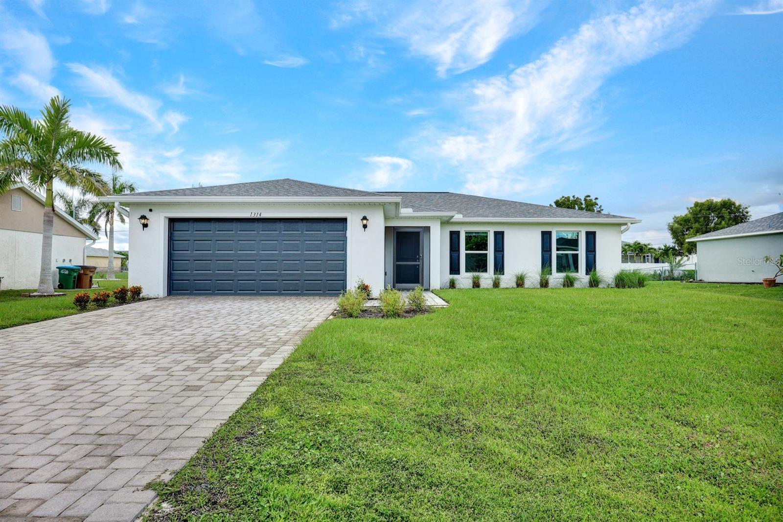 Lovely SW Cape Coral home for sale! Built in 2024! Enter this bright, open concept home through the spacious foyer. The great room has a vaulted ceiling & sliding doors to the screened lanai. The kitchen features vaulted ceiling, quartz countertops, white shaker cabinets, large island with counter space for stools, stainless steel appliances, spacious eating area with a window, plus a pantry. The primary bedroom is spacious & features an ensuite bathroom with a large walk-in shower, dual sinks, water closet, linen closet & huge walk-in closet. Across the home you'll find 3 more bedrooms, a guest bathroom & linen closet. The laundry room is situated between the kitchen & garage with shelving & an extra storage closet with shelves. Enjoy the outdoors in the spacious, screened back lanai with pavers or the large back yard. There is an attached two car garage & paver driveway. This home is better than new as the owners have added custom window shades & curtains, gutters & downspouts, screened the front & back lanais, added light or fan fixtures & more! On city water with all assessments paid! Don't miss your opportunity to see and purchase this home!