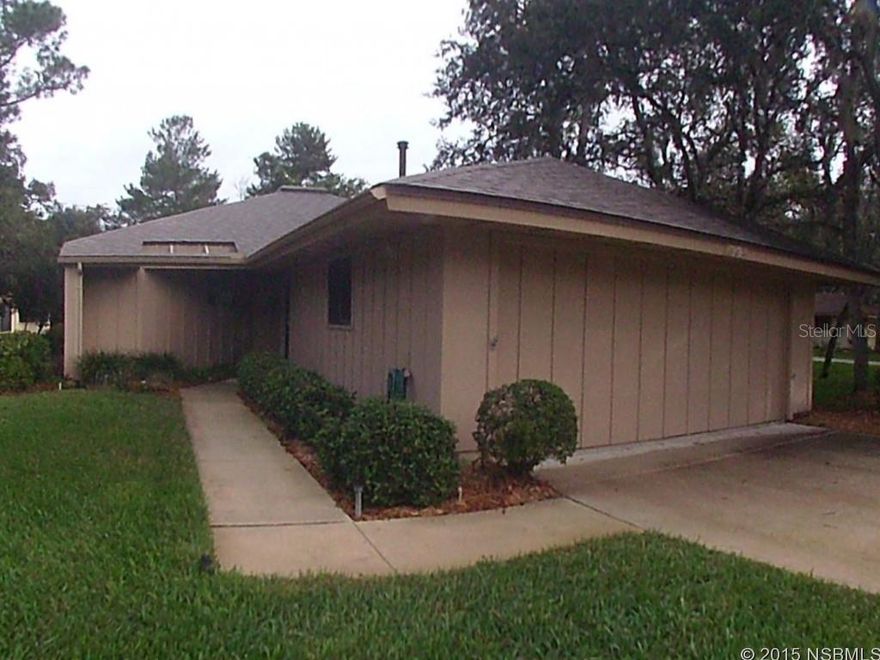 Expanded "B" model home in beautiful St. Andrews area of Sugar Mill CC.  Home is three bedroom/two bath open plan with a two car garage, large screened porch, and inside laundry room.  Roof was replaced four years ago.  Home is well landscaped and the exterior yard/shrub maintenance is included in Association dues.  Also included in the dues are painting the home every six years, heated Community pool, maintenance of the common grounds, private roads, and gated entry. ;Water: City