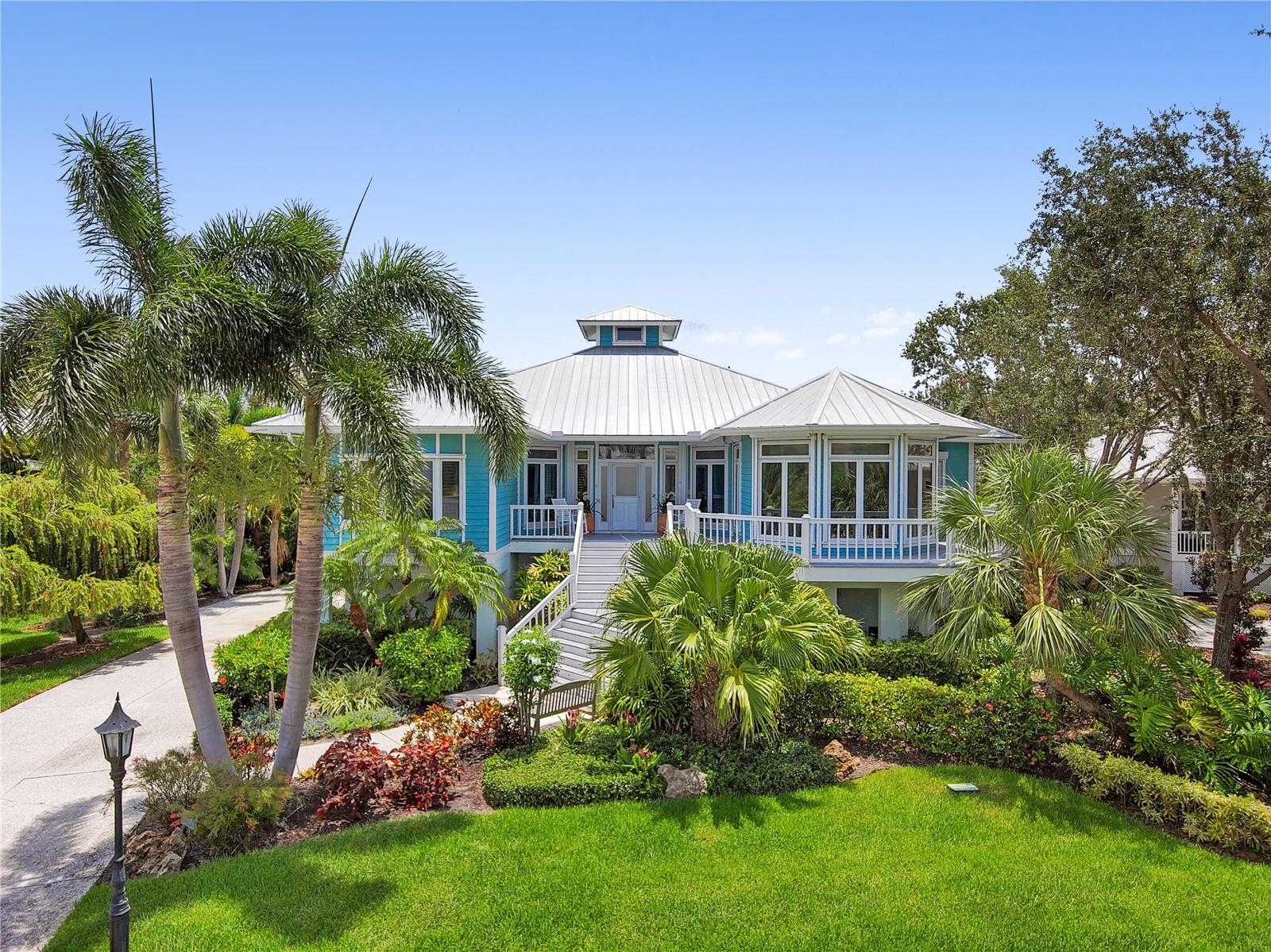 Under contract-accepting backup offers. Historic waterfront community of Eagle Point Club! Custom Key West style 4 bed + study, 3.5 baths, 2-car oversized garage pool home with assigned boat slip and 14,000 lb. lift at marina on Roberts Bay offering 5-minute sailboat access to the Gulf of Mexico! Eagle Point is a lushly landscaped community with old world charm rich in heritage and history. It was originally a Clubhouse with 10 guest cottages and later developed into a gated boating community with 44 lots maintaining the historic ambiance of one of the most unique communities on Florida’s west coast. Original vision by Bertha Palmer and was a fishing and hunting resort and is listed on the National Historic Register. Over 3,700 sf featuring soaring ceilings, oversized bedrooms, fabulous Chef’s kitchen with quartz, GE Café double oven, Sub-Zero refrigerator/freezer and Wolf 36” 5-burner gas cooktop with exhaust pop-up fan. Expansive covered upstairs outside lanai for entertaining overlooking screened heated pool with access to first floor cabana - all for family and guests to enjoy. Mature landscaping surrounds property for added privacy and island feel. Amazing community close to downtown Venice with fine dining and shopping, Venetian Waterway Park and Legacy Trail Park providing 20 miles of bicycling and walking trails and just a short trip to world-class Venice beaches. Minutes by boat to Venice Yacht Club. Historical clubhouse steeped in tradition and guest cottage are highlights of the community and are meticulously maintained for short term use by family members and guests. Amenities also include tennis/pickleball courts and shared boathouse at marina. Truly a one-of-a-kind community to call home!
