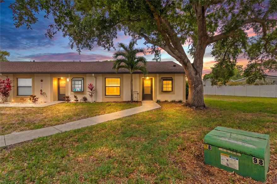 One or more photos have been virtually staged. 
Discover comfort, convenience, and peace of mind in this beautifully maintained **end unit** located in the sought-after Deerwood Gardens community. This light-filled 2-bedroom home offers enhanced privacy and an inviting layout, complemented by major recent upgrades including a **new roof installed at the end of 2024** and a **new A/C system added in 2025**—a rare combination of value and long-term reliability.

Step inside to an open living and dining area with plenty of natural light, leading to a functional kitchen with ample storage and workspace. Both bedrooms are generously sized, offering flexibility for guests, a home office, or a quiet retreat. The end-unit placement provides additional windows, improved airflow, and a more spacious feel throughout.

Residents enjoy access to a sparkling community pool, clubhouse, and well-kept grounds, creating a welcoming environment for year-round enjoyment. With assigned parking, on-site amenities, and a low-maintenance lifestyle, this home is ideal for full-time living or seasonal use.

Perfectly positioned just minutes from shopping, dining, golf courses, parks, and the award-winning Gulf beaches, this Largo location offers the best of Florida living. Move-in ready, updated where it counts, and located in a peaceful community—this is a home you’ll want to see in person.
