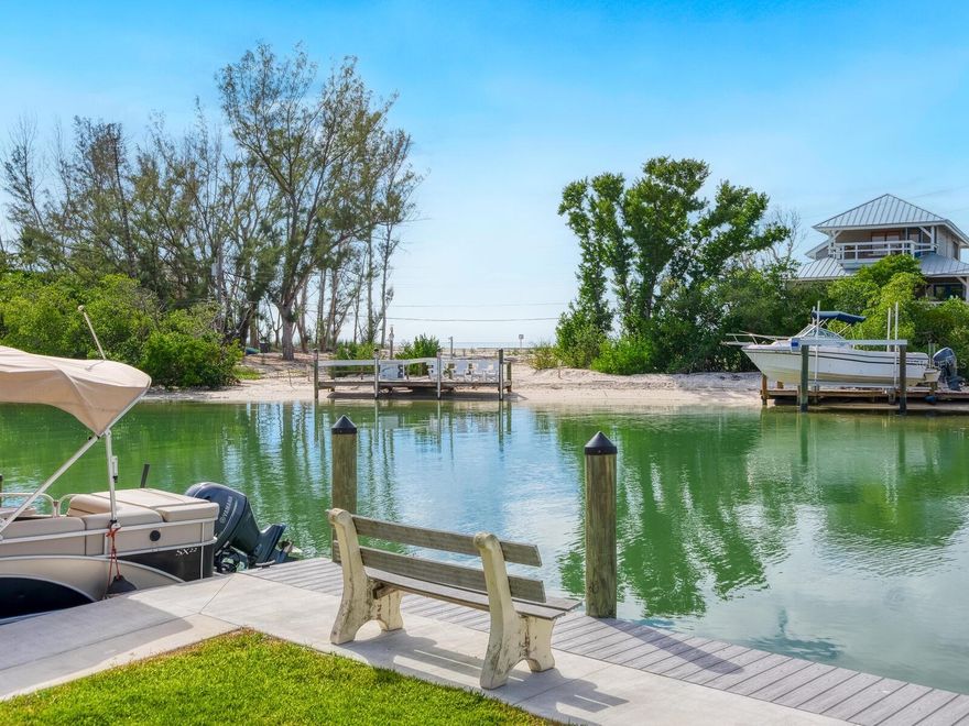 Welcome to your boutique waterfront condominium community, Castaway Cove at the south end of Siesta Key.
This is one of only 8 condos, an end unit with a private boat slip on a saltwater canal with quick access to the
Gulf of Mexico. Open floorplan with 2 beds, 2 baths, great room and dining room views as well as a screened
rear porch overlooking the canal and the Gulf. Enjoy sunsets watching the waves crashing on the beach and the
manatees and dolphins splashing in your back yard. Grab a kayak and go for a perfect paddle through the
mangrove tunnels or out Midnight Pass into the Gulf. Utilize the available kayak storage. New seawall and new
roof on the building. The trolley is nearby and will take you right up the road to Siesta Beach or the Village. Yes,
you can have it all on Siesta Key!