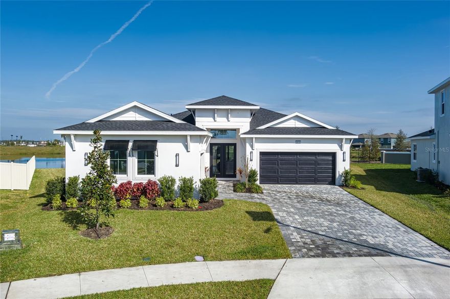 Now available for rent, this brand-new 2025 single-family home in Parrish, Florida offers 3 bedrooms, 2.5 bathrooms, and 2,480 square feet of thoughtfully designed living space on an oversized cul-de-sac lot with direct pond frontage. Located in the highly desirable Parrish Lakes community, this home provides modern comfort, upscale finishes, and a peaceful setting just minutes from shopping, dining, major roadways, and the community’s highly anticipated future lagoon amenity. Parrish Lakes is proud to introduce the upcoming MetroLagoons experience—already hugely popular worldwide—bringing a resort-style coastal lifestyle right to your doorstep. Planned lagoon amenities are expected to span approximately 5 to 15 acres and include crystal-clear waters, sandy beaches, and a full amenity center where residents can enjoy a variety of activities or simply relax and take in the scenic views, all without leaving the neighborhood. Upon entry, a spacious foyer with soaring 12-foot ceilings creates a bright and welcoming atmosphere, leading into an open-concept great room with tray ceilings and expansive 16-foot sliding glass doors that open to a covered paver lanai overlooking tranquil pond views. The lanai is pre-wired for a future summer kitchen, making it ideal for outdoor entertaining and relaxed Florida evenings. The gourmet kitchen features a large center island, sleek flat-panel cabinetry, modern finishes, and an oversized walk-in pantry. A sunlit breakfast nook with water views adds charm and functionality, making the space perfect for both everyday living and hosting guests. The split-bedroom floor plan offers privacy, while 10-foot ceilings, upgraded beveled White Oak luxury vinyl plank flooring, and 8-foot interior doors enhance the home’s elevated design throughout. The primary suite serves as a private retreat, featuring peaceful pond views, generous closet space, and a spa-inspired Roman shower with dual shower heads. Additional highlights include a three-car garage with opener, wall-mounted TV outlets, ground-level construction, sidewalk-lined streets, and pet-friendly options subject to owner approval. This new construction rental home in Parrish, FL presents a rare opportunity to lease a modern residence with premium features, water views, and future resort-style lagoon living. With most comparable homes already occupied, this property stands out as one of the best rental opportunities currently available in the area. Schedule your private showing today!