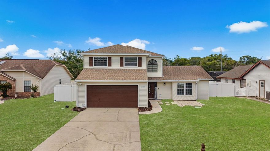 One or more photo(s) has been virtually staged. Welcome to 1668 Spicewood Lane — a spacious two-story home tucked away in the established Spicewood community of Casselberry. Situated on an oversized fenced lot, this 3-bedroom, 2.5-bath home offers over 2,100 square feet of living space with room to spread out, entertain, and make it your own. From the moment you arrive, you’ll appreciate the charming curb appeal, extended driveway, and inviting entryway.

Inside, soaring ceilings, abundant natural light, and multiple living spaces create the perfect blend of comfort and functionality. The oversized living and dining areas provide flexibility for entertaining, working from home, or everyday living. The cozy family room features a stunning stone wood-burning fireplace and flows seamlessly into the kitchen and breakfast nook. Neutral finishes, laminate flooring upstairs, and tile throughout the main living areas make this home move-in ready while still allowing room to personalize.

The kitchen offers ample cabinet and countertop space, stainless steel appliances, breakfast bar seating, and views overlooking the backyard and gathering spaces. Just beyond the family room is a fully enclosed sunroom converted into a versatile bonus space perfect for a home office, gym, playroom, media room, art studio, homeschool area, guest retreat, or additional entertaining lounge.

Upstairs, the spacious primary suite features an oversized walk-in closet and remodeled private bath, while the secondary bedrooms offer comfortable accommodations for family or guests.

One of the standout features of this property is the massive fully fenced backyard with endless possibilities. Add a pool, outdoor kitchen, firepit, garden, or even an ADU/mother-in-law suite for multigenerational living. Whether you envision weekend barbecues, relaxing evenings outdoors, or extra space for pets to roam, this backyard delivers.

Located in the heart of Casselberry, this home offers convenient access to shopping, dining, parks, major roadways, and top Seminole County schools including Sterling Park Elementary, South Seminole Middle, and Lake Howell High School. Low HOA fees and a two-car garage add even more value.

This home has been thoughtfully maintained with major updates including a NEW ROOF (2019), renovated second floor, updated kitchen appliances, remodeled half bath, 2024 water heater, updated laundry room plumbing (2022), and a 2014 water softener. The AC was installed in 2008 and regularly serviced. Additional upgrades include a 2016 vinyl fence, mailbox, belt-driven garage opener, and multiple septic updates including a new drain field (2014), new top cover and filter (2023), and regular maintenance with the latest pump completed in March 2025. The home also includes a transferable home warranty and two termite bonds for added peace of mind.

Homes with this much space, flexibility, and backyard potential rarely come available at this price point. Schedule your private showing today and experience everything 1668 Spicewood Lane has to offer.
